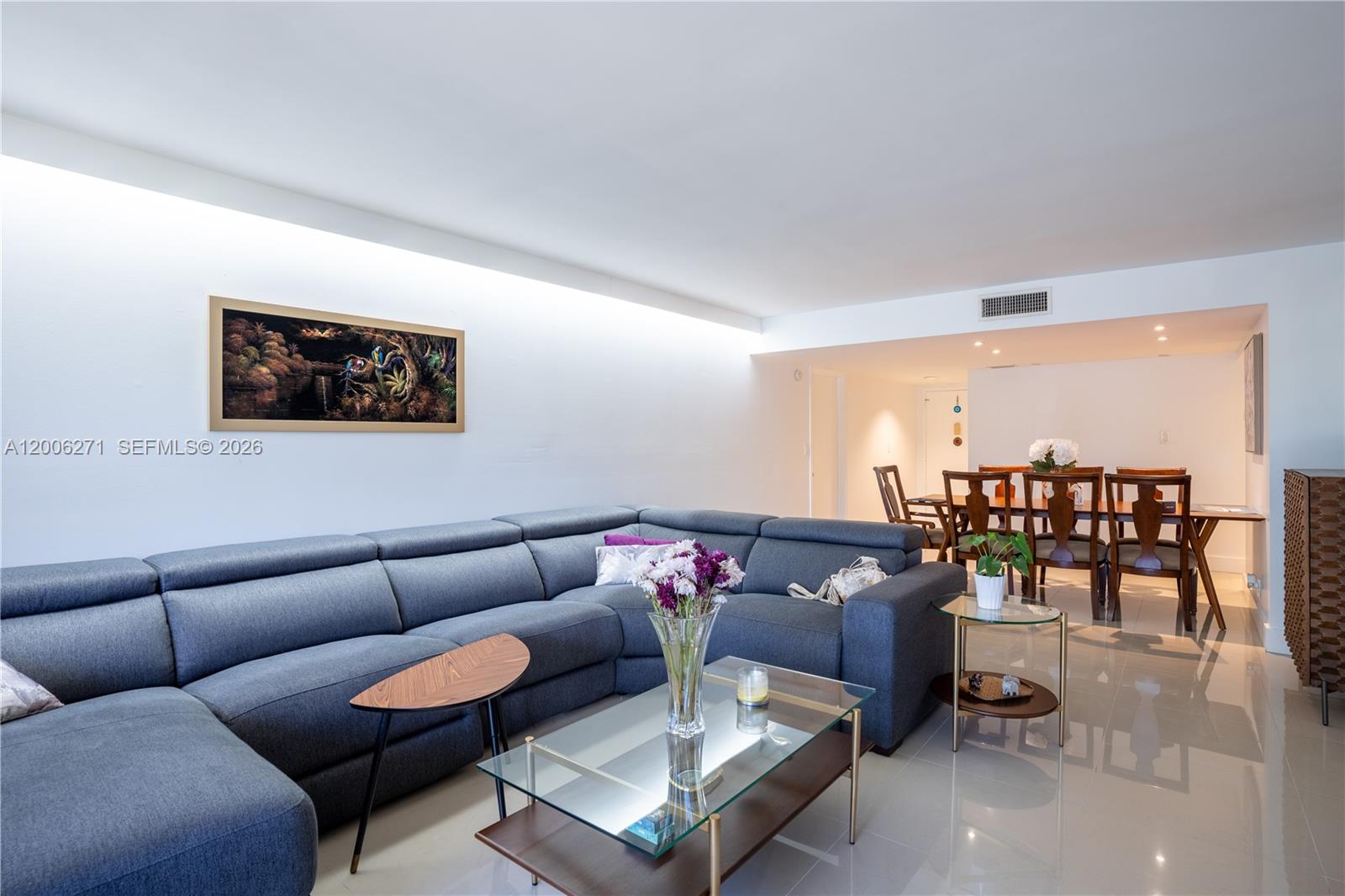 16300 Golf Club Road, Unit 204 Weston, FL 33326 - Photo 5 of 16 a living room with furniture and a table