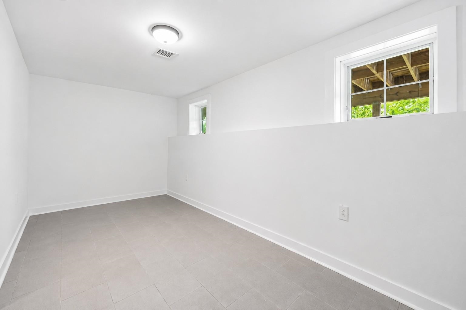 107 Mountain Road Jersey City, NJ 07307 - Photo 33 of 41 an empty room with windows