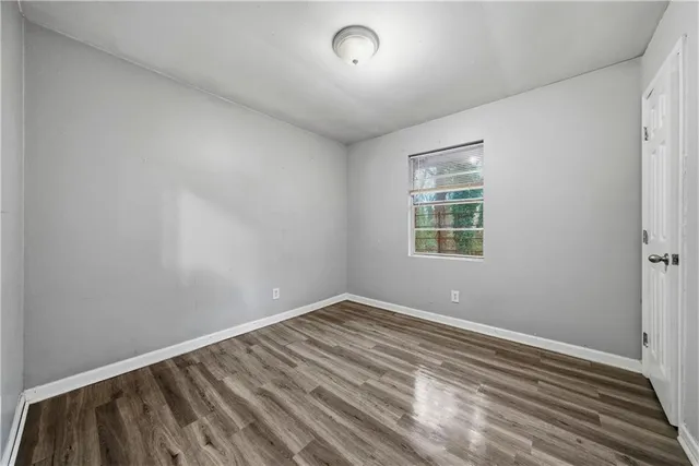 a view of room with window and ceiling fan