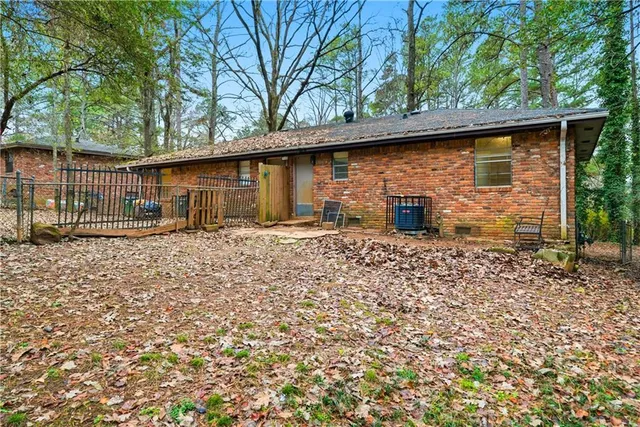 a backyard of a house with barbeque oven