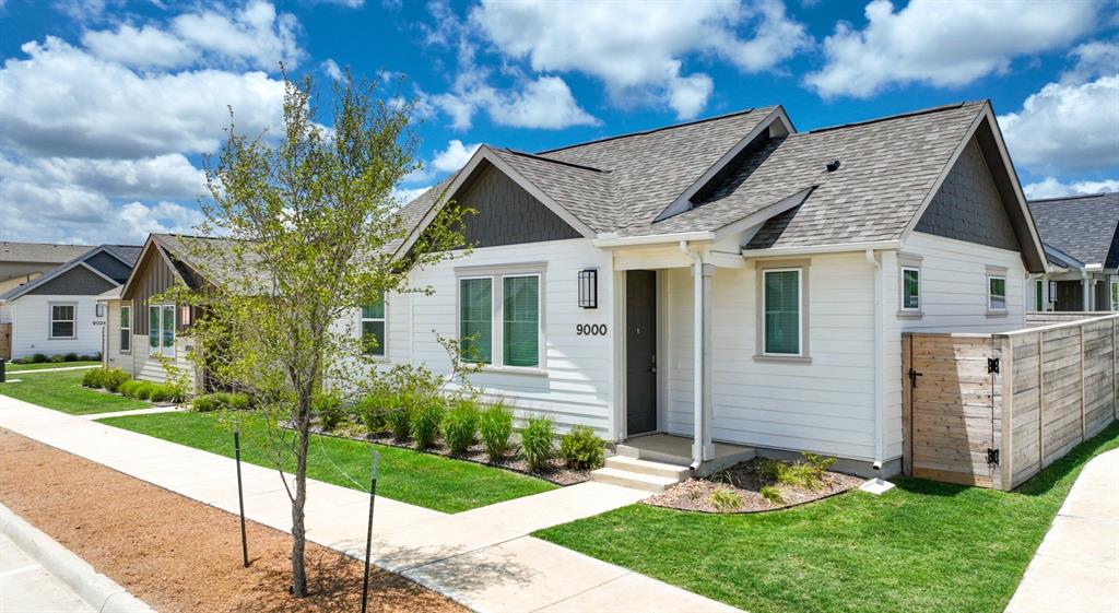 9013 Peridot Way Fort Worth, TX 76123 - Photo 13 of 27 a front view of a house with a garden and plants