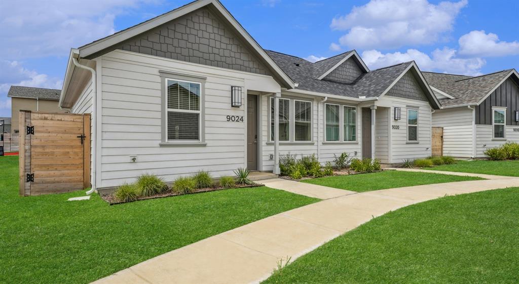 9013 Peridot Way Fort Worth, TX 76123 - Photo 14 of 27 a view of a house with a small yard and a large tree