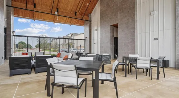a view of an outdoor dining space with furniture