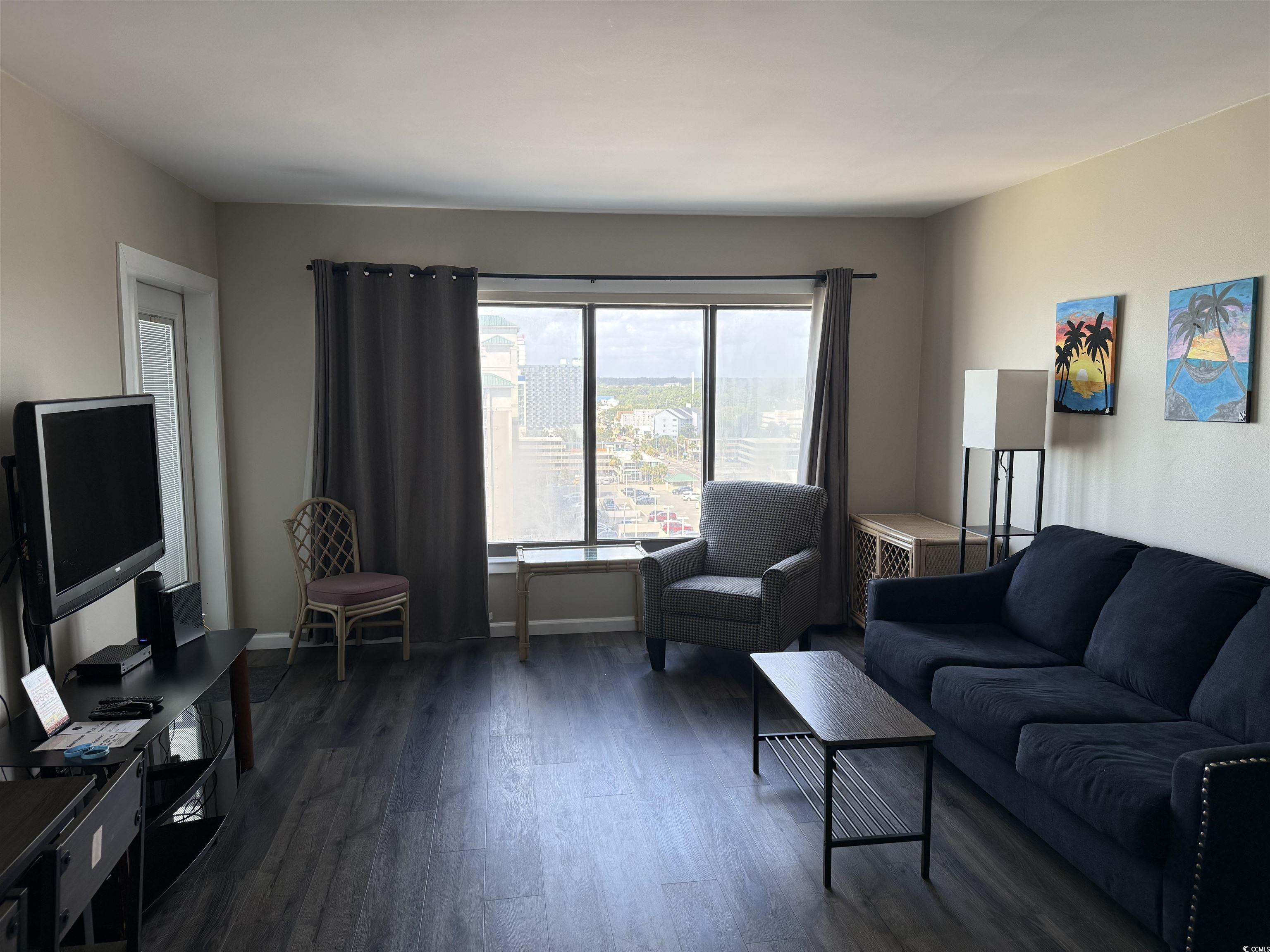 1605 South Ocean Boulevard, Unit 1211 Myrtle Beach, SC 29577 - Photo 13 of 22 Living room with dark wood-type flooring