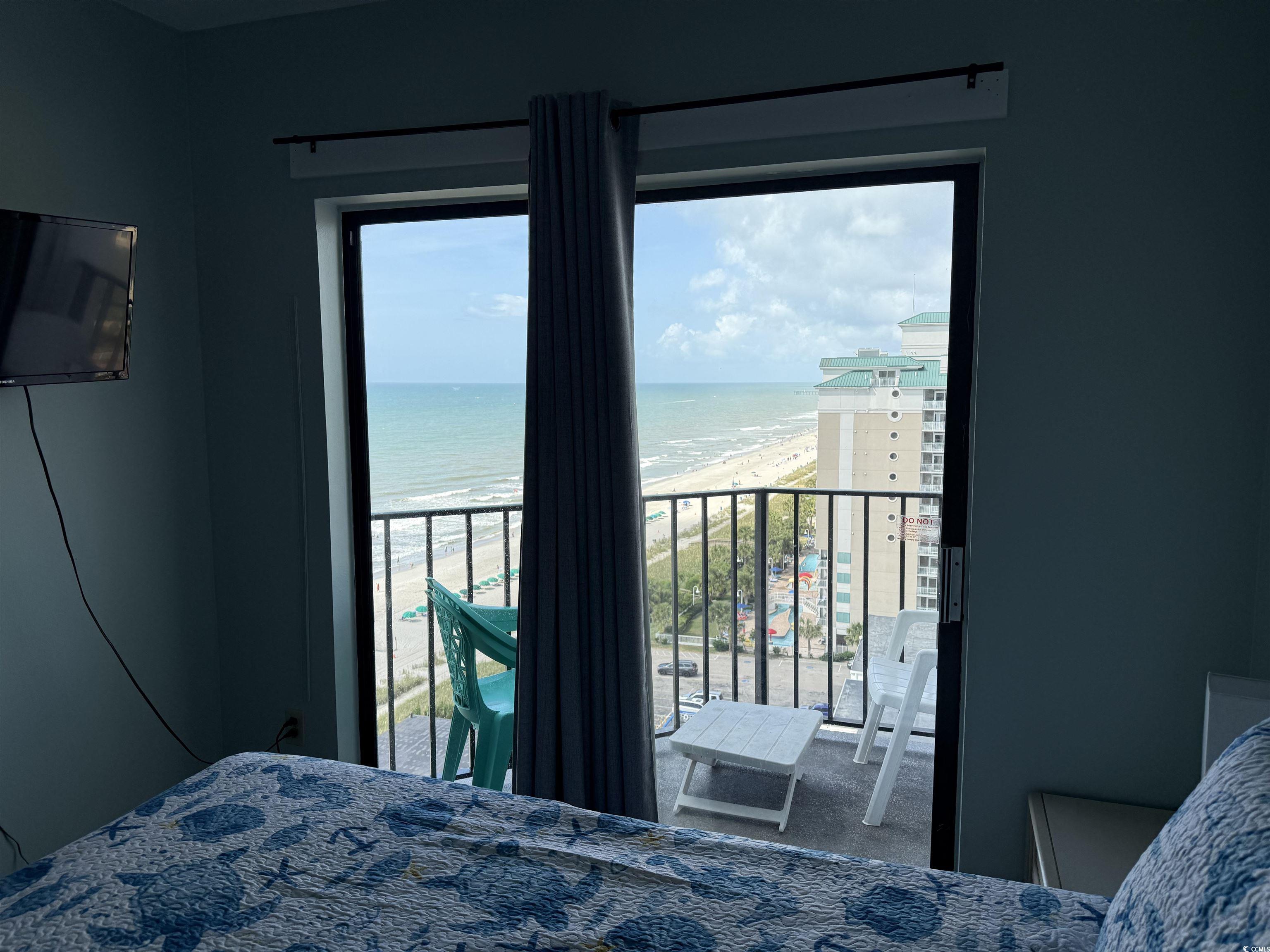 1605 South Ocean Boulevard, Unit 1211 Myrtle Beach, SC 29577 - Photo 19 of 22 Bedroom with wood finished floors