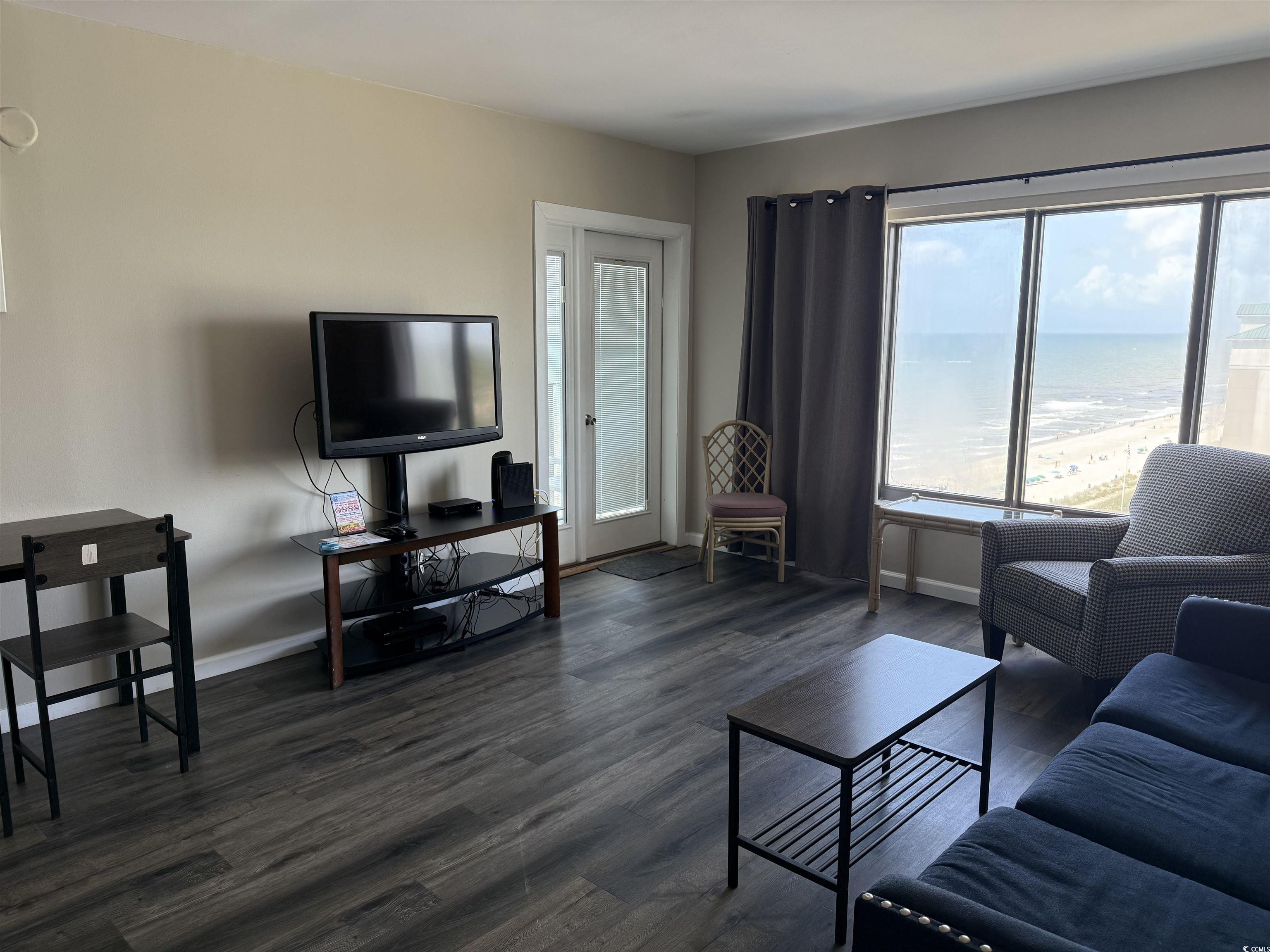 1605 South Ocean Boulevard, Unit 1211 Myrtle Beach, SC 29577 - Photo 10 of 22 Living room featuring dark wood-style floors
