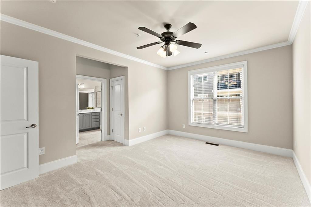 6468 Chariot Street, Unit 19 Atlanta, GA 30328 - Photo 17 of 43 a view of an empty room with a window