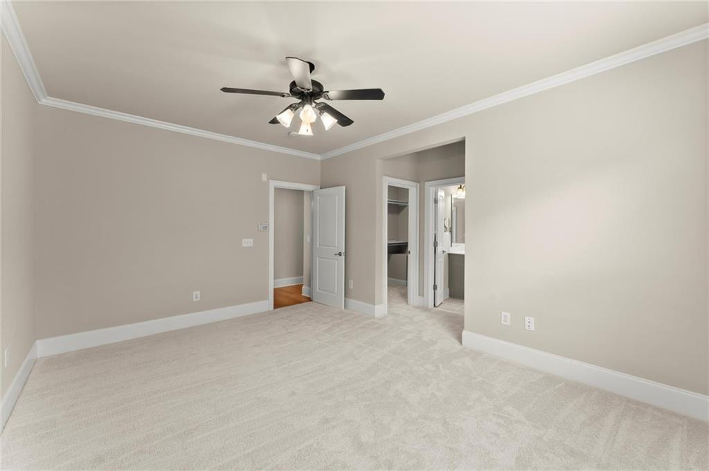 6468 Chariot Street, Unit 19 Atlanta, GA 30328 - Photo 18 of 43 a view of an empty room with a ceiling fan