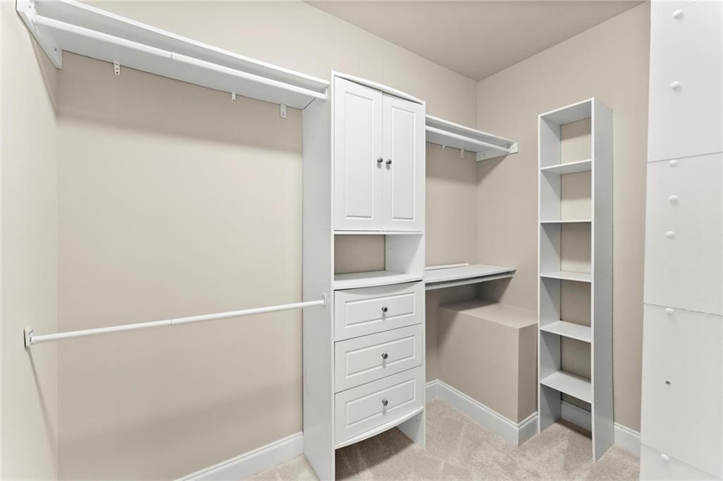 6468 Chariot Street, Unit 19 Atlanta, GA 30328 - Photo 21 of 43 a view of an empty walk in closet