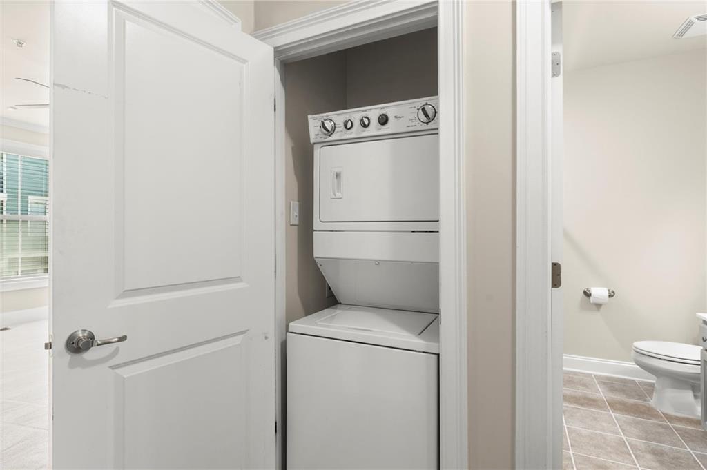6468 Chariot Street, Unit 19 Atlanta, GA 30328 - Photo 22 of 43 a utility room with dryer and washer