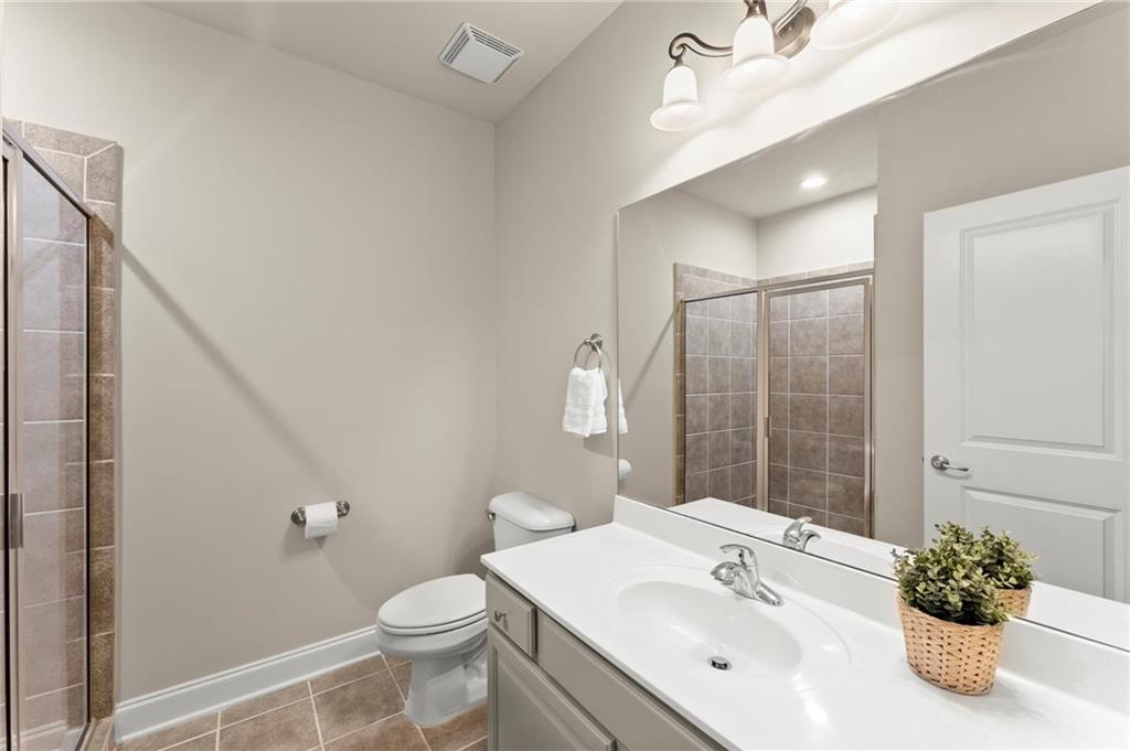 6468 Chariot Street, Unit 19 Atlanta, GA 30328 - Photo 25 of 43 a bathroom with a sink toilet and shower