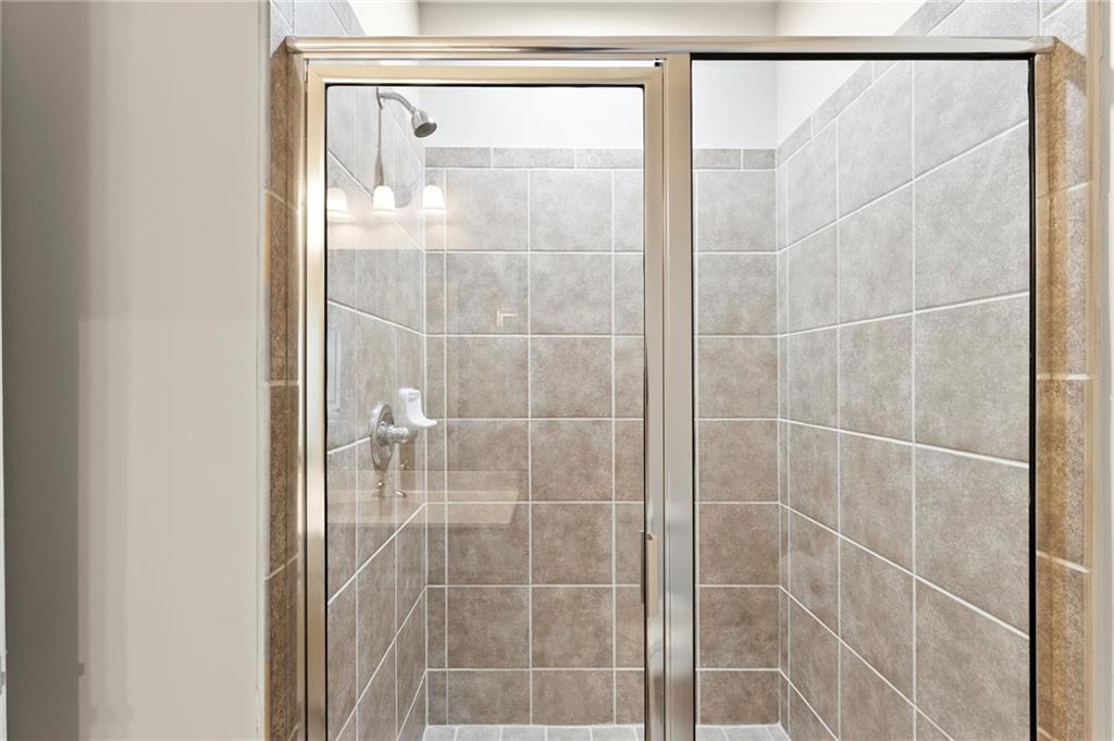 6468 Chariot Street, Unit 19 Atlanta, GA 30328 - Photo 26 of 43 a bathroom with a shower