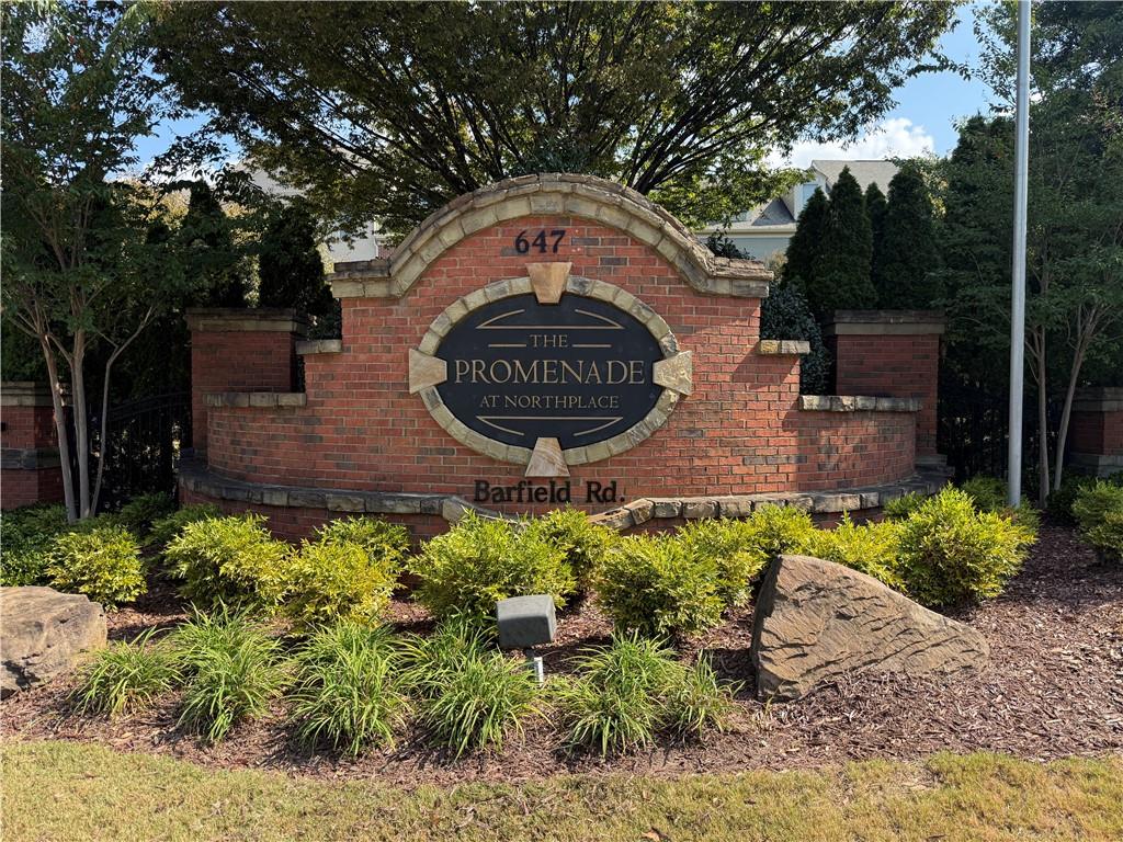 6468 Chariot Street, Unit 19 Atlanta, GA 30328 - Photo 35 of 43 a sign that is sitting on a brick wall