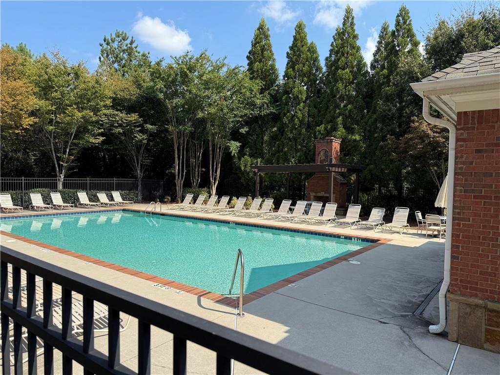 6468 Chariot Street, Unit 19 Atlanta, GA 30328 - Photo 36 of 43 a view of swimming pool with a patio