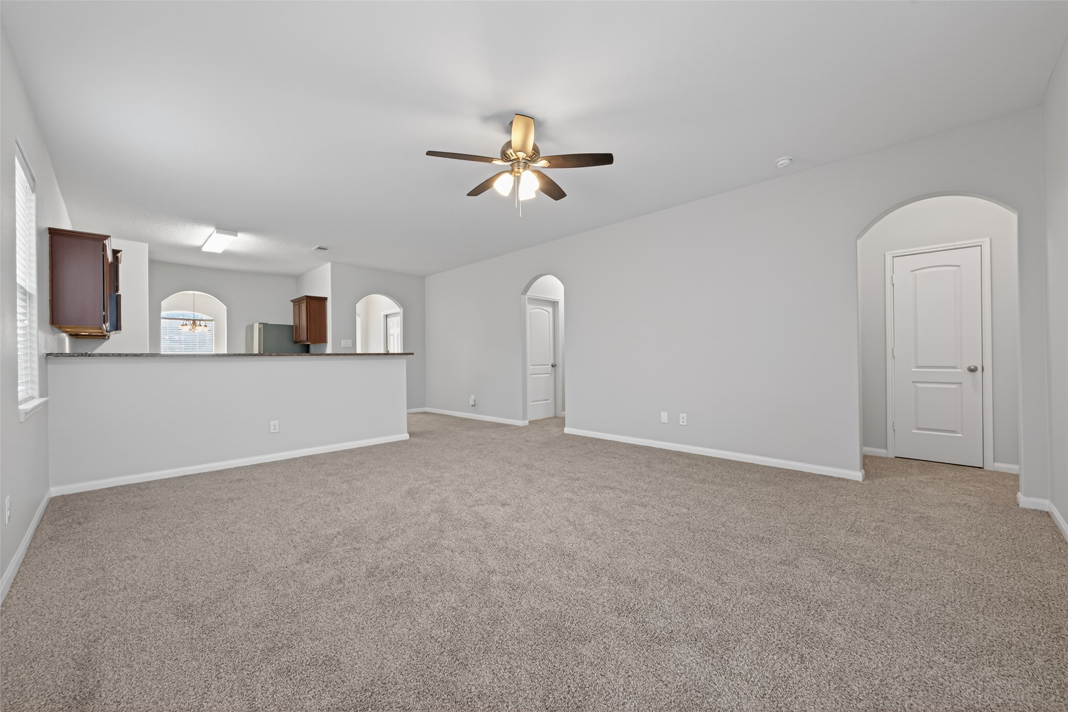 12038 Powderhorn Lane Pinehurst, TX 77362 - Photo 21 of 50 a view of a livingroom with furniture and chandelier fan