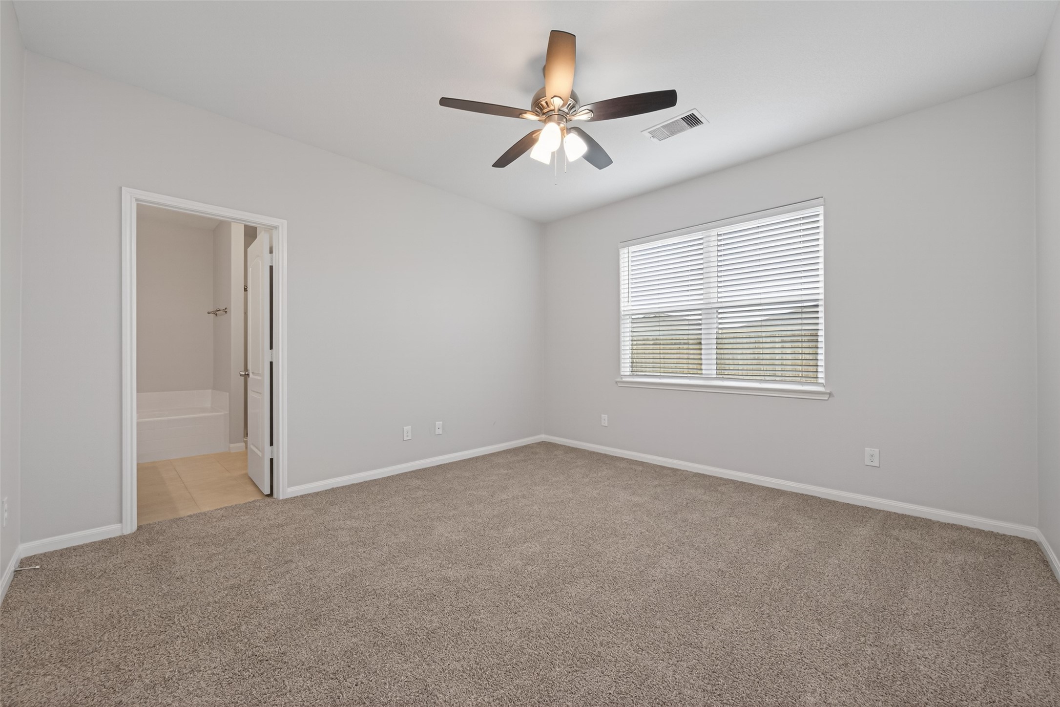 12038 Powderhorn Lane Pinehurst, TX 77362 - Photo 24 of 50 a view of an empty room with a window