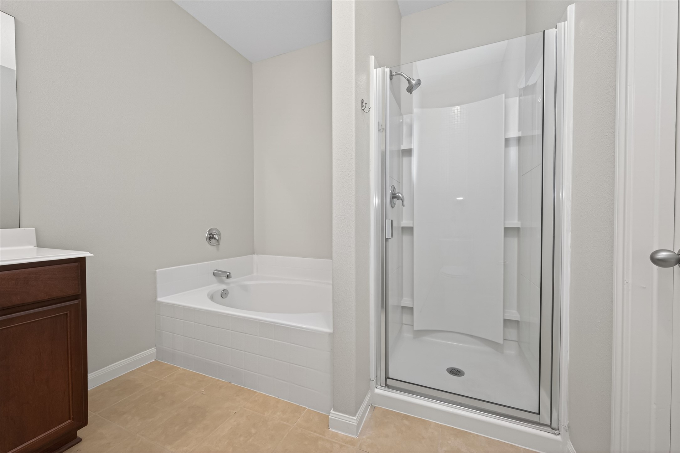 12038 Powderhorn Lane Pinehurst, TX 77362 - Photo 28 of 50 a bathroom with a bathtub and a shower