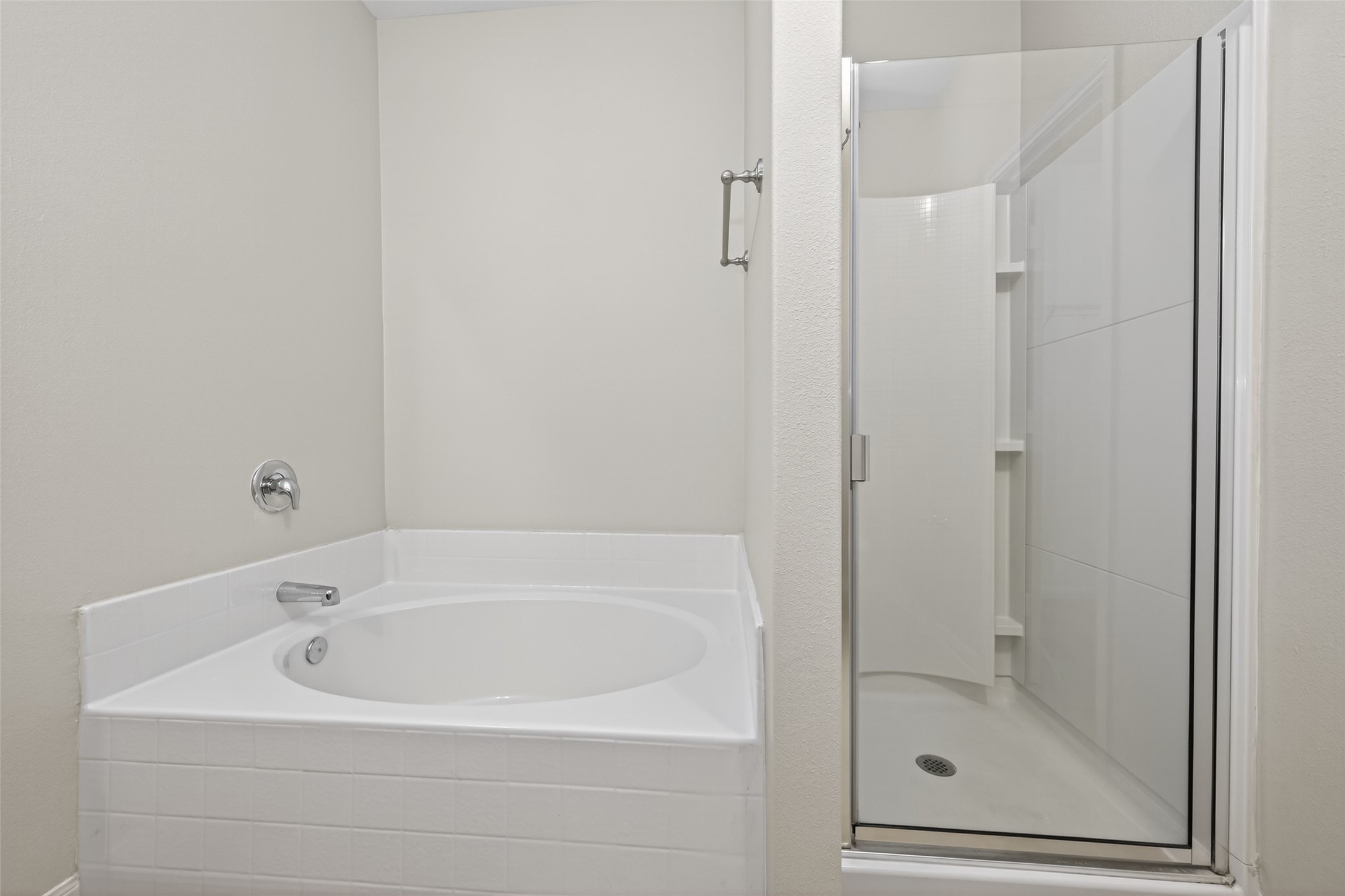 12038 Powderhorn Lane Pinehurst, TX 77362 - Photo 29 of 50 a white bath tub sitting next to a shower