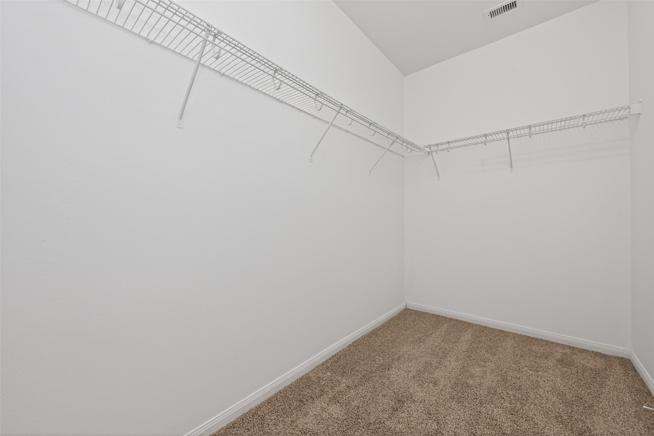 12038 Powderhorn Lane Pinehurst, TX 77362 - Photo 33 of 50 a view of a room with racks on the wall