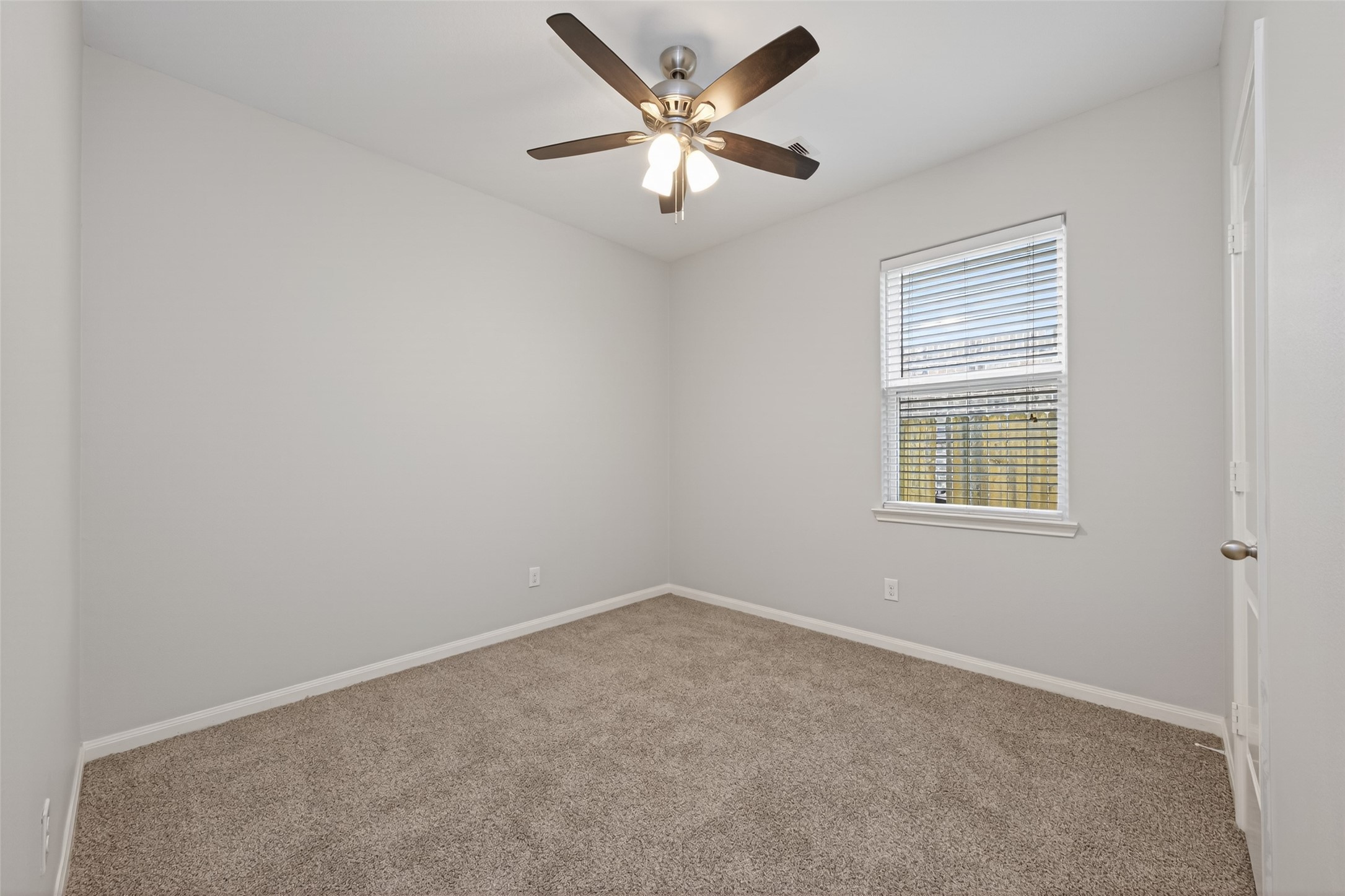 12038 Powderhorn Lane Pinehurst, TX 77362 - Photo 35 of 50 an empty room with closet and a ceiling fan