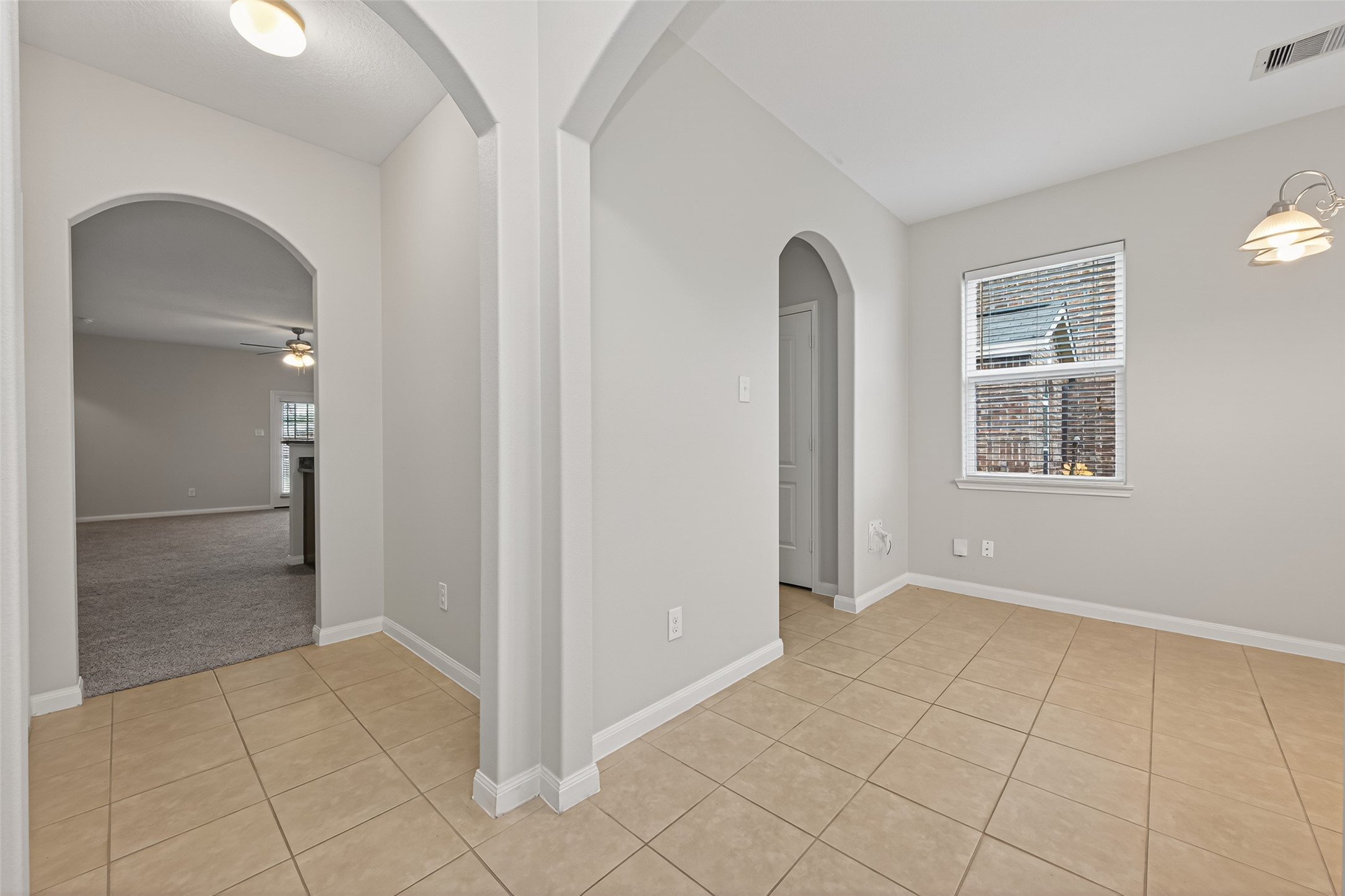 12038 Powderhorn Lane Pinehurst, TX 77362 - Photo 4 of 50 an empty room with windows and closet