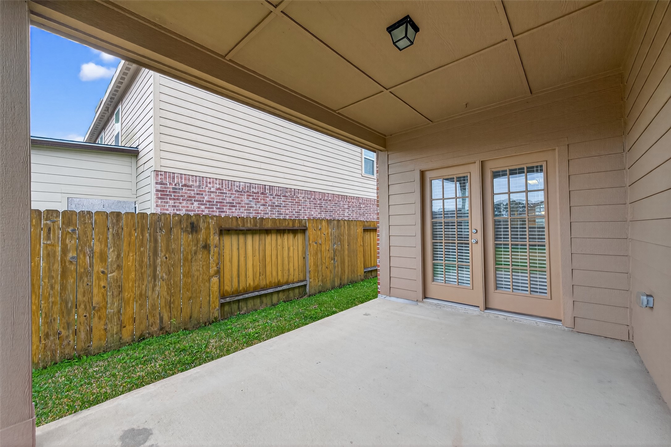 12038 Powderhorn Lane Pinehurst, TX 77362 - Photo 42 of 50 a view of a house with backyard and porch