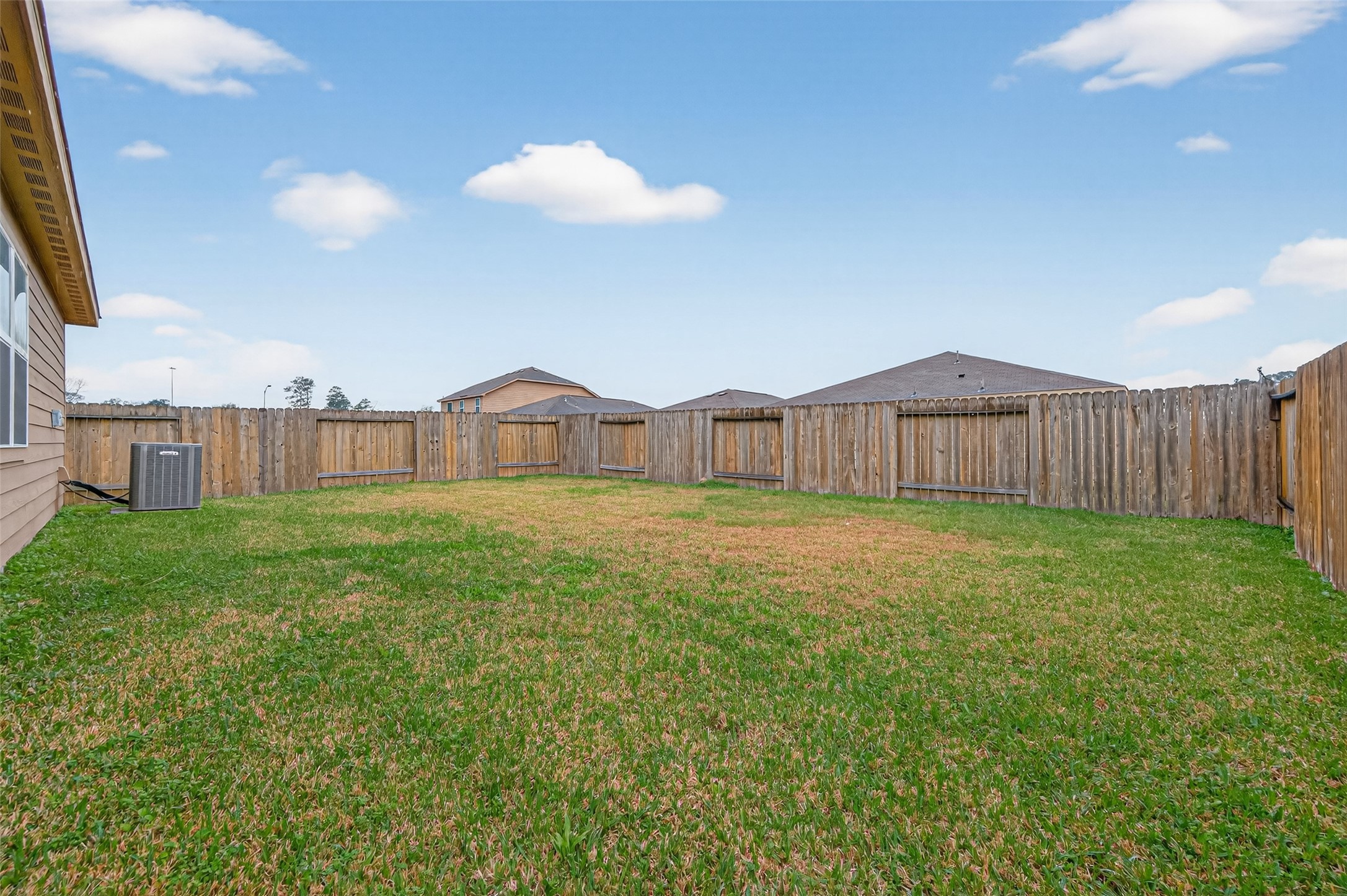 12038 Powderhorn Lane Pinehurst, TX 77362 - Photo 43 of 50 a view of a house with backyard