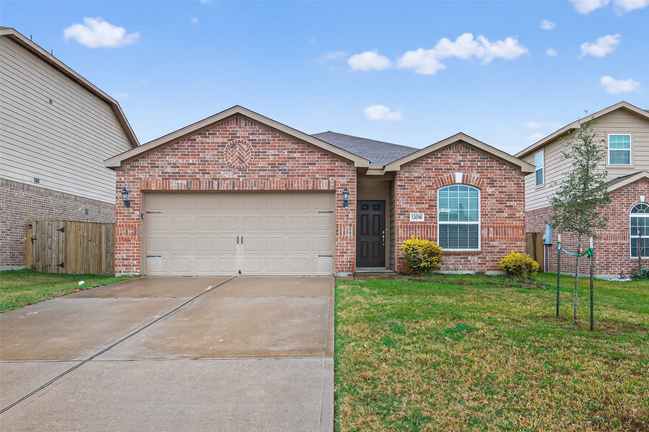 12038 Powderhorn Lane Pinehurst, TX 77362 - Photo 48 of 50 a view of a house with a yard and garage