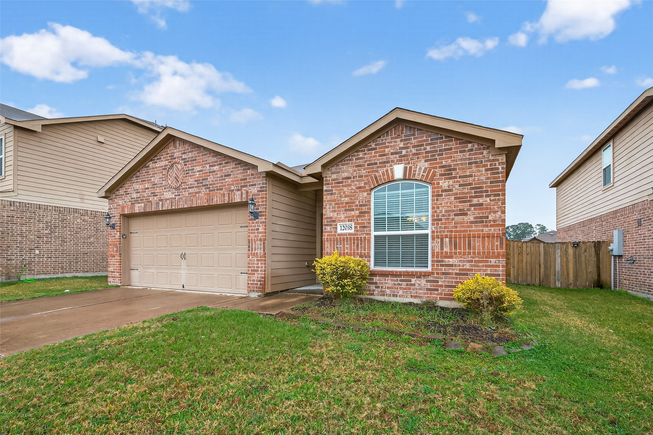 12038 Powderhorn Lane Pinehurst, TX 77362 - Photo 49 of 50 a front view of a house with garden