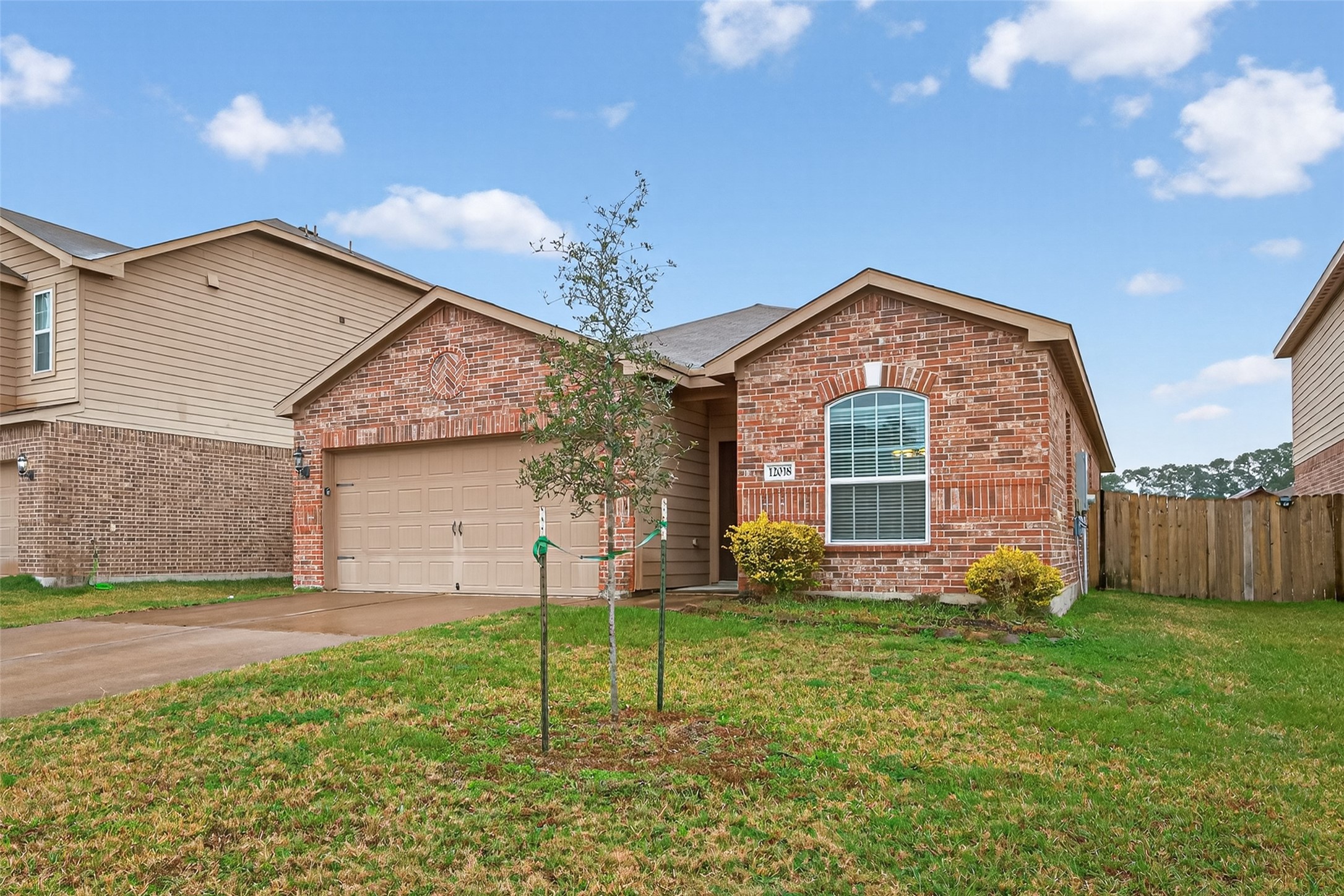 12038 Powderhorn Lane Pinehurst, TX 77362 - Photo 50 of 50 a front view of a house with garden
