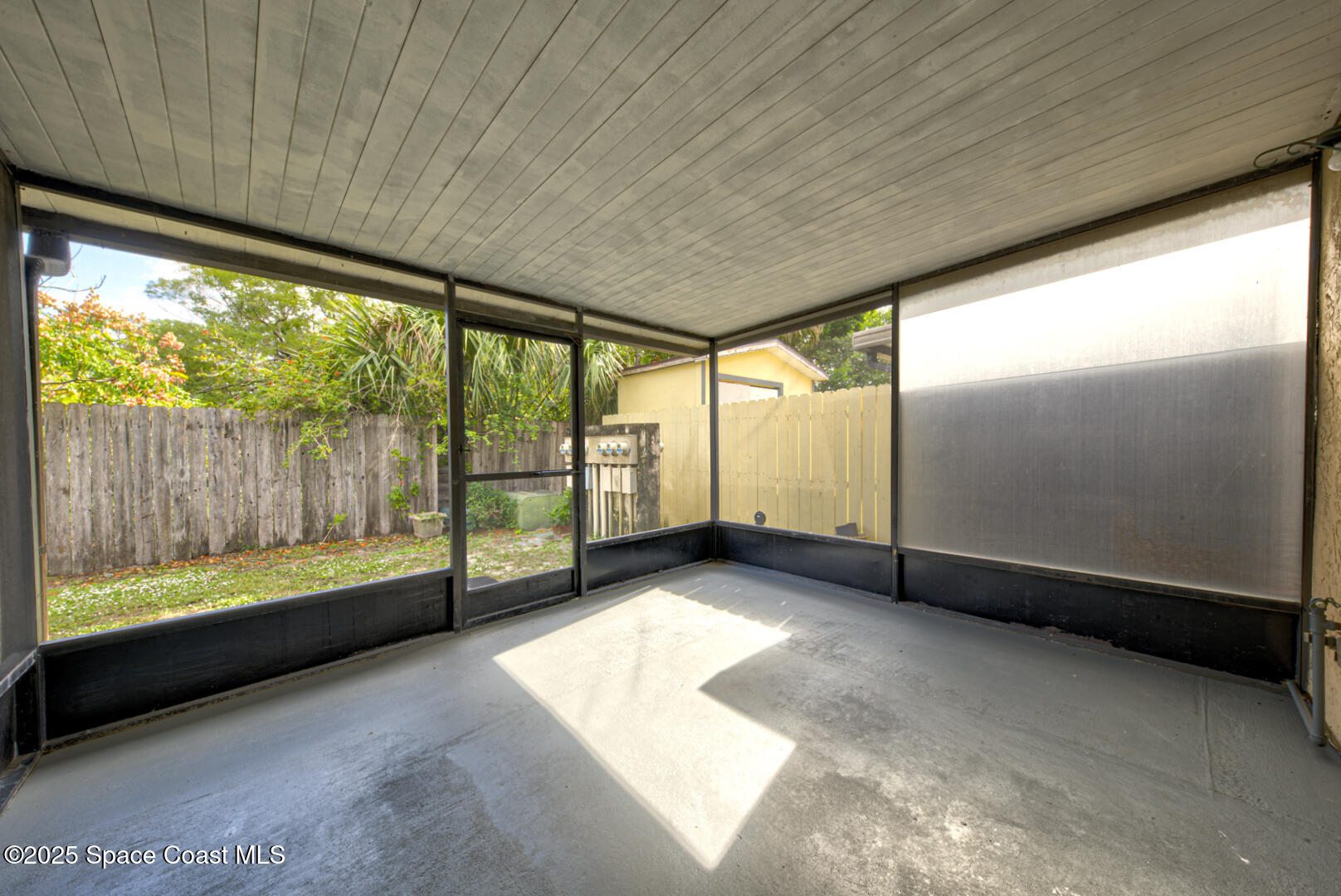 4749 Sisson Road Titusville, FL 32780 - Photo 28 of 30 screened-in back porch