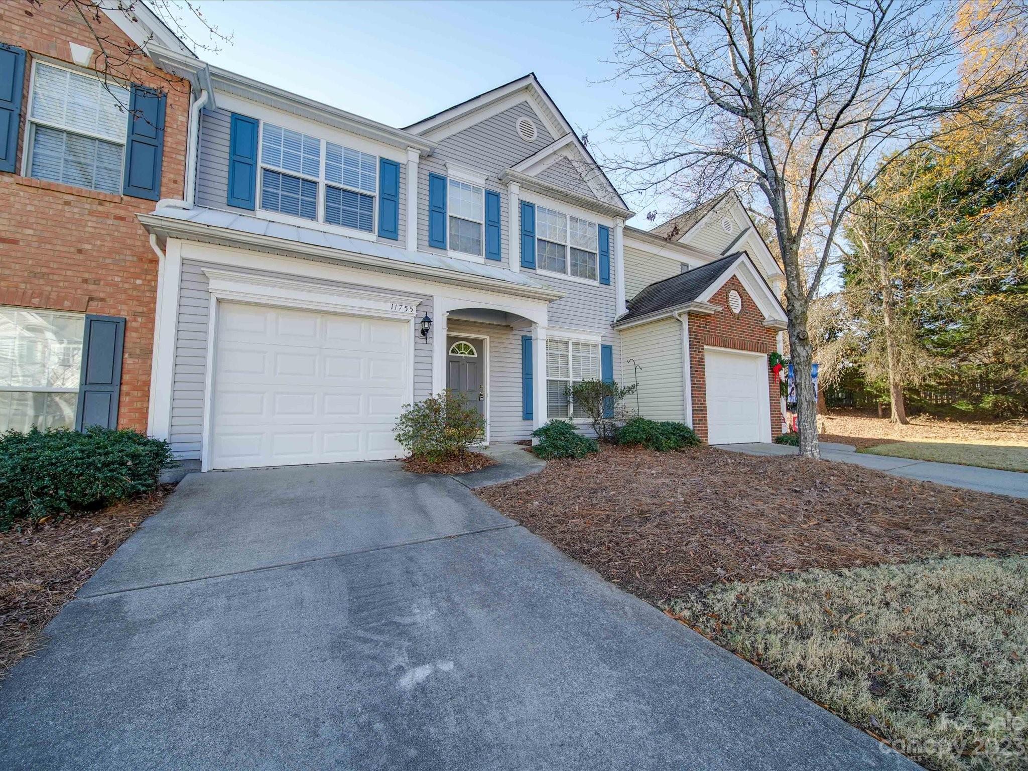 11755 Huxley Road Charlotte, NC 28277 - Photo 1 of 37 a view of a house with a yard and large tree