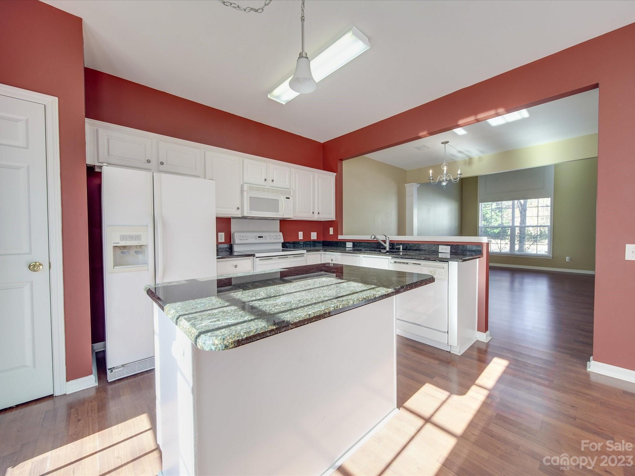 11755 Huxley Road Charlotte, NC 28277 - Photo 12 of 37 a kitchen with stainless steel appliances granite countertop a sink refrigerator and cabinets