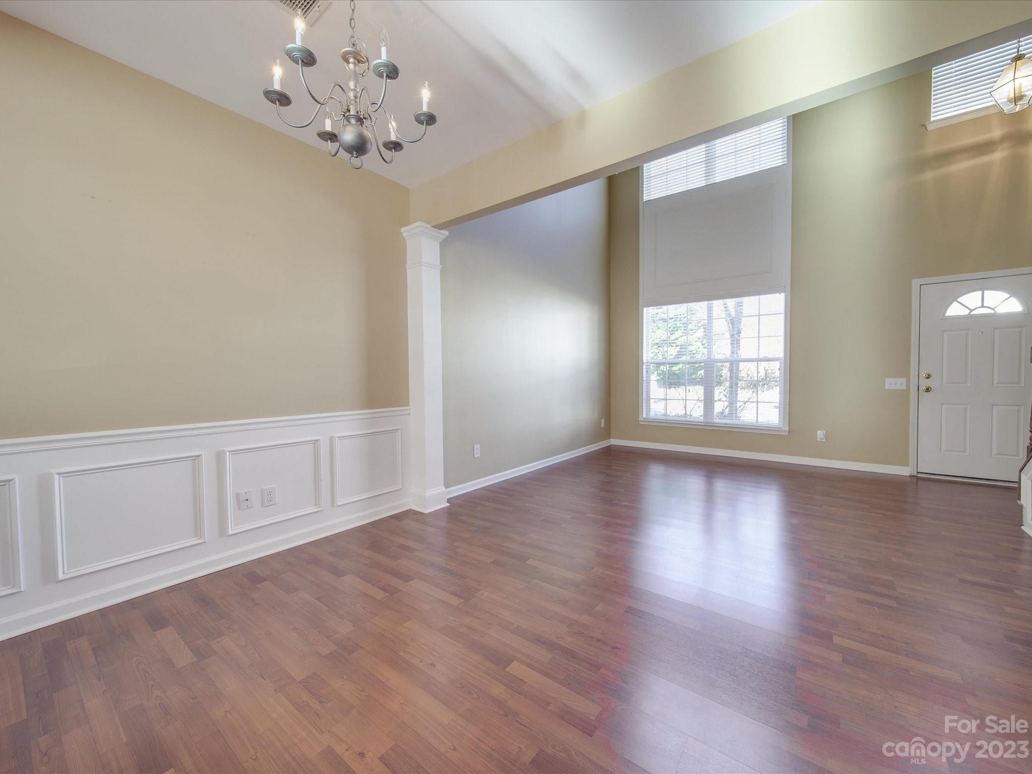 11755 Huxley Road Charlotte, NC 28277 - Photo 16 of 37 wooden floor in an empty room with a window