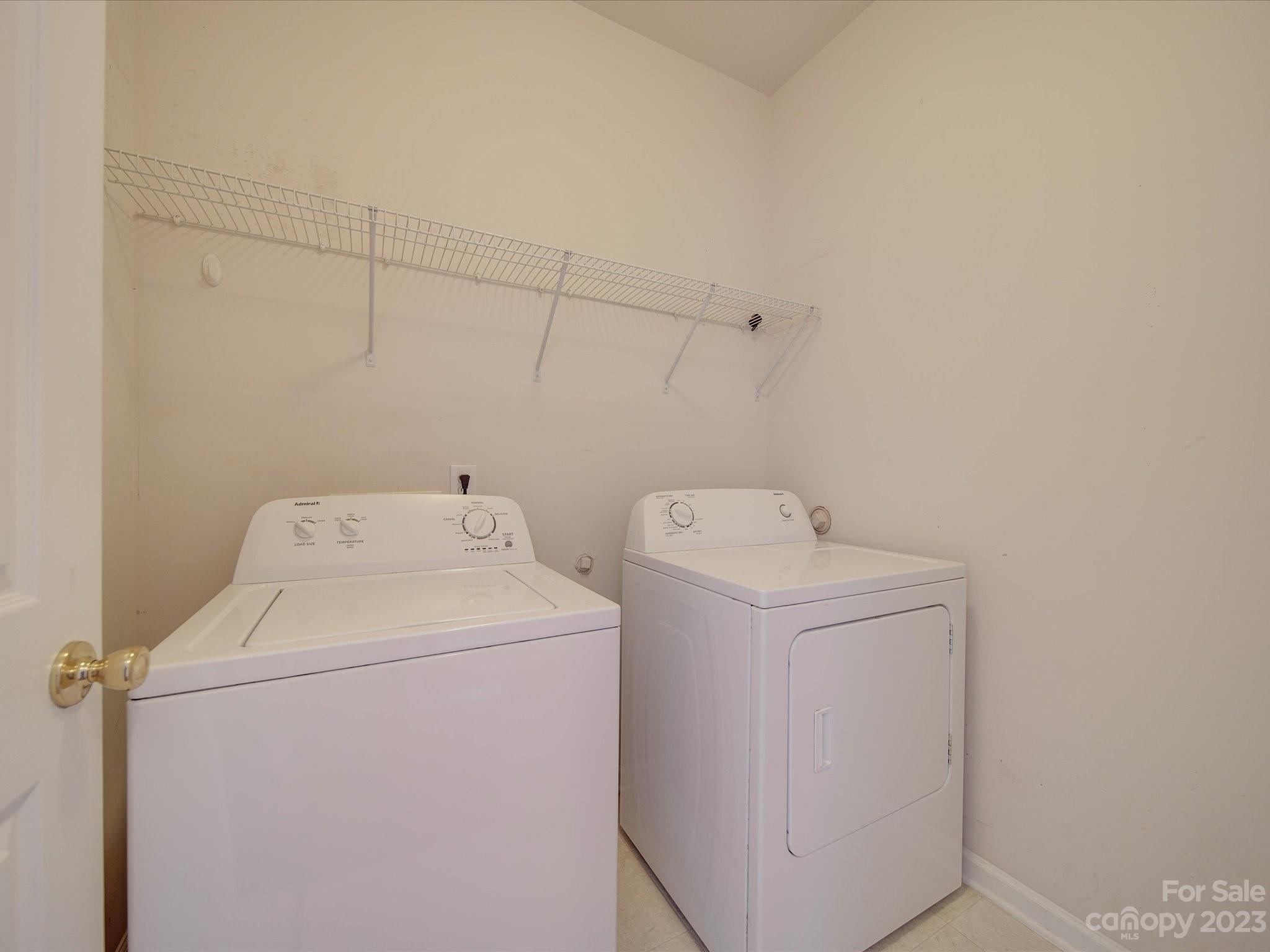 11755 Huxley Road Charlotte, NC 28277 - Photo 18 of 37 a utility room with dryer and washer