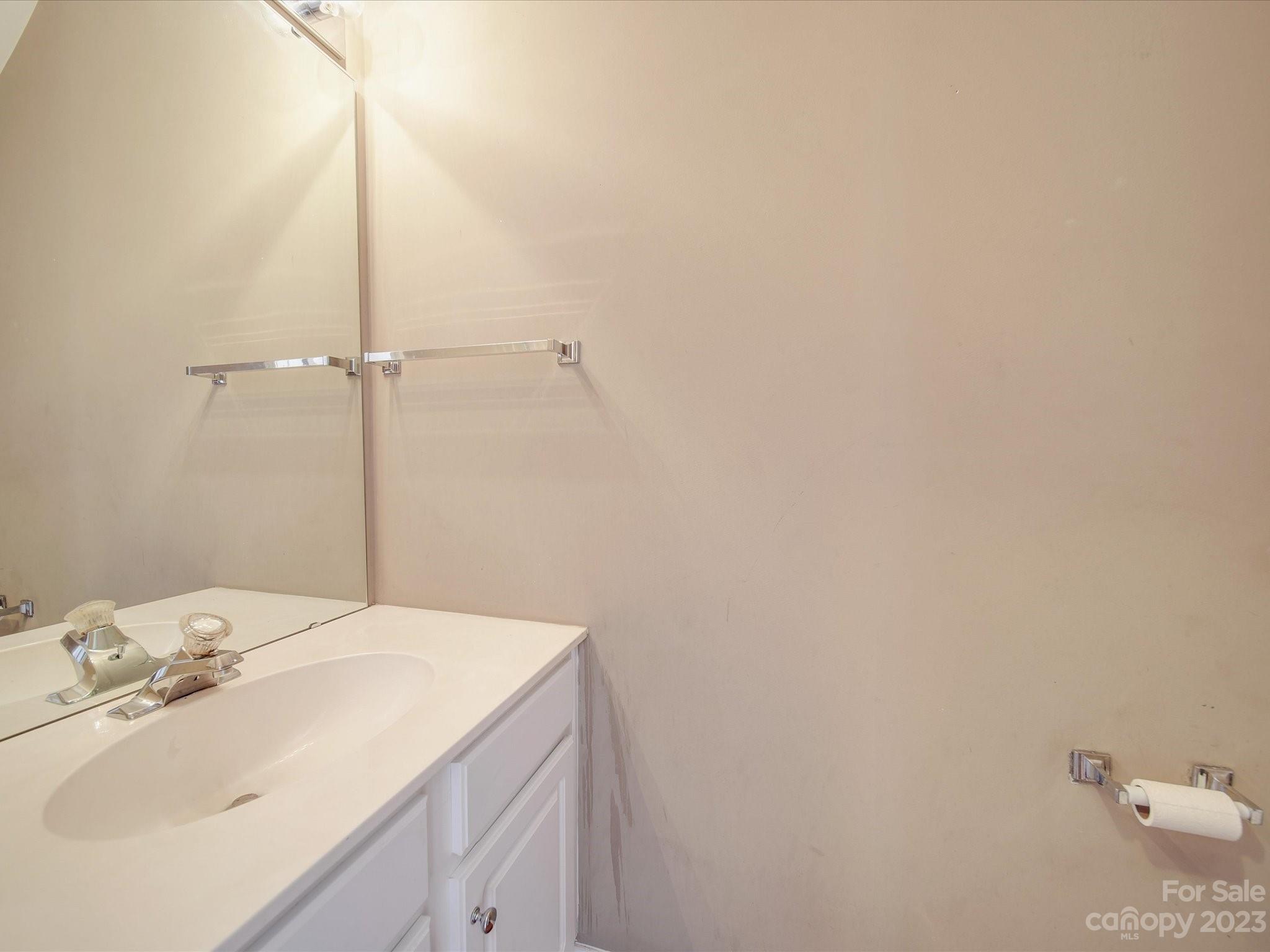 11755 Huxley Road Charlotte, NC 28277 - Photo 19 of 37 a bathroom with a sink and vanity