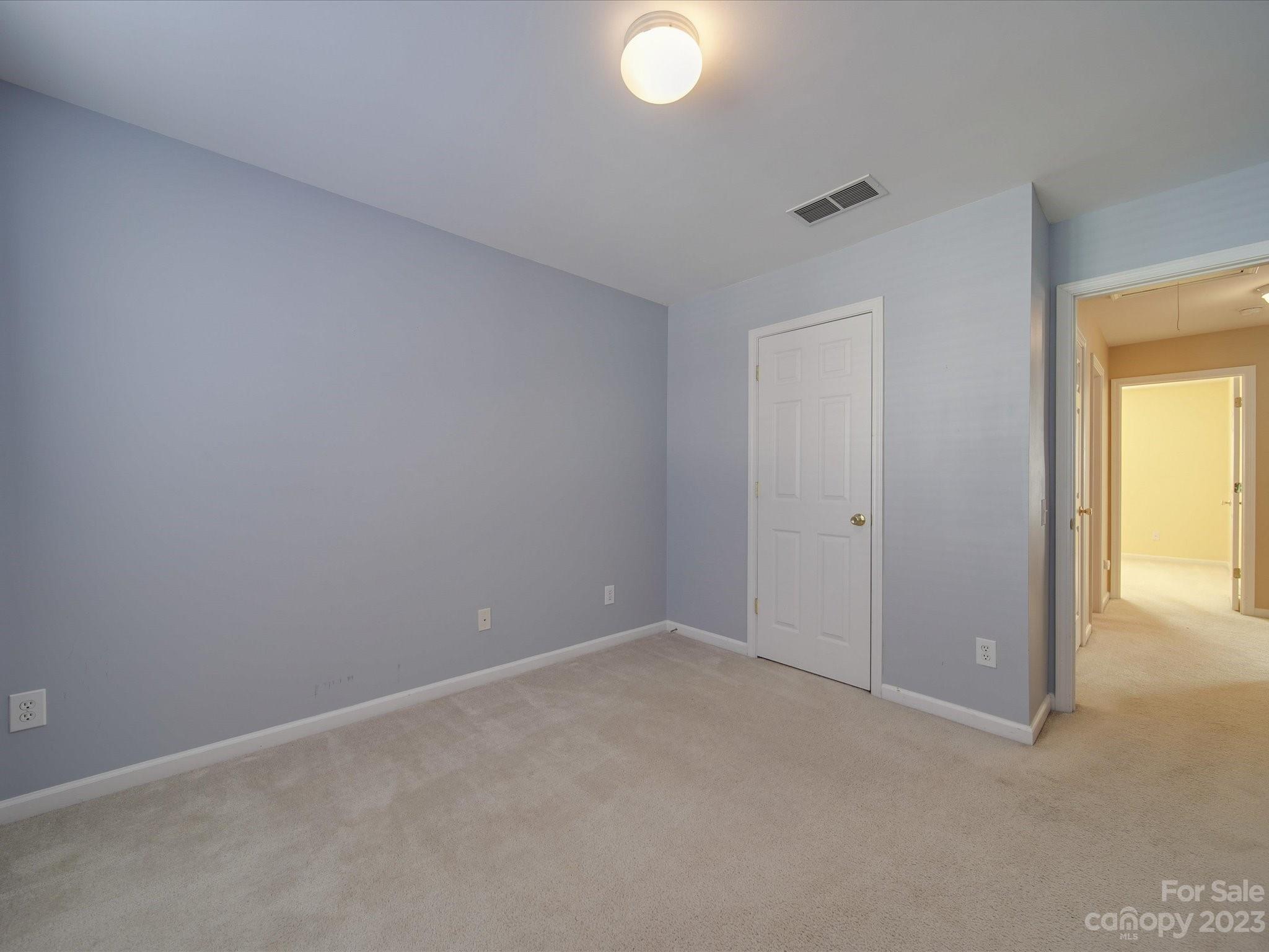 11755 Huxley Road Charlotte, NC 28277 - Photo 20 of 37 an empty room with windows and closet