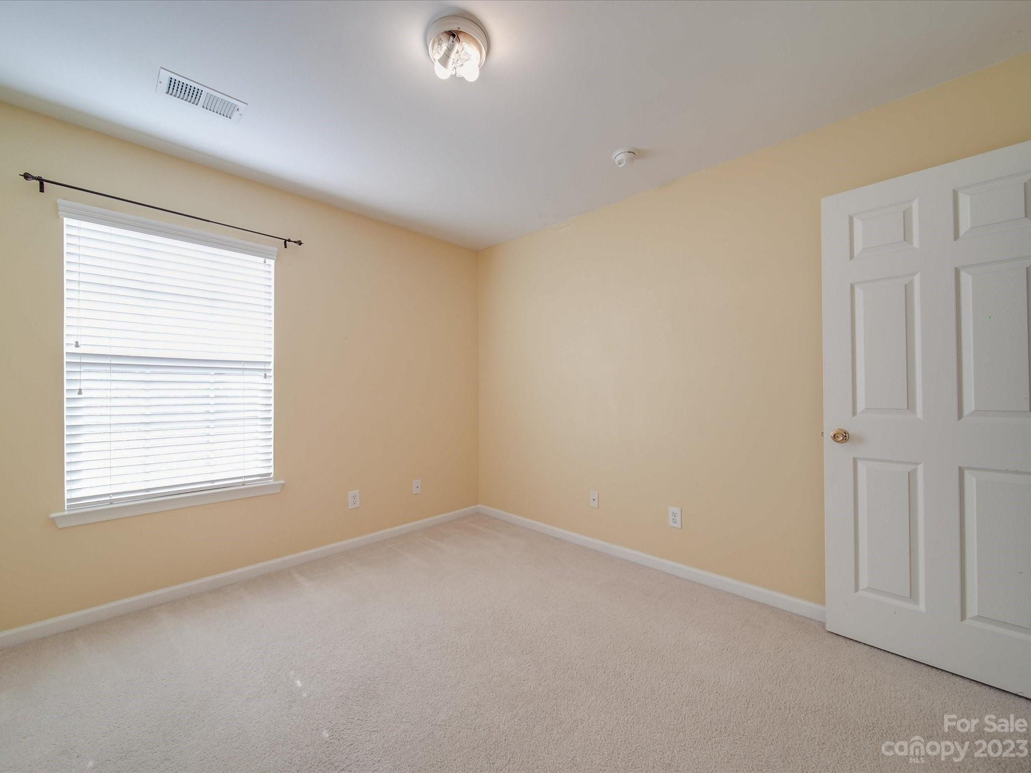 11755 Huxley Road Charlotte, NC 28277 - Photo 21 of 37 an empty room with a window