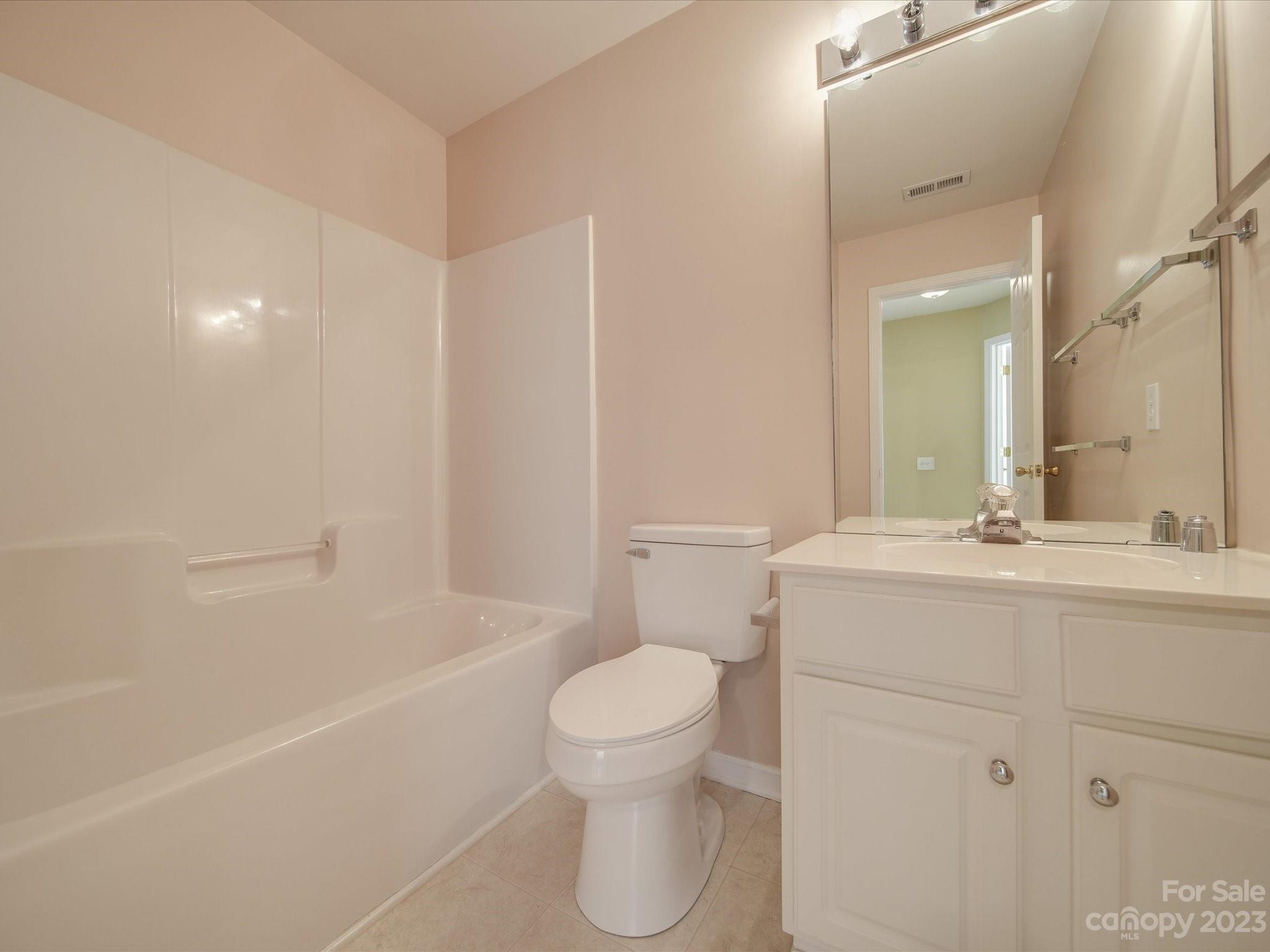 11755 Huxley Road Charlotte, NC 28277 - Photo 24 of 37 a bathroom with a sink a toilet and shower