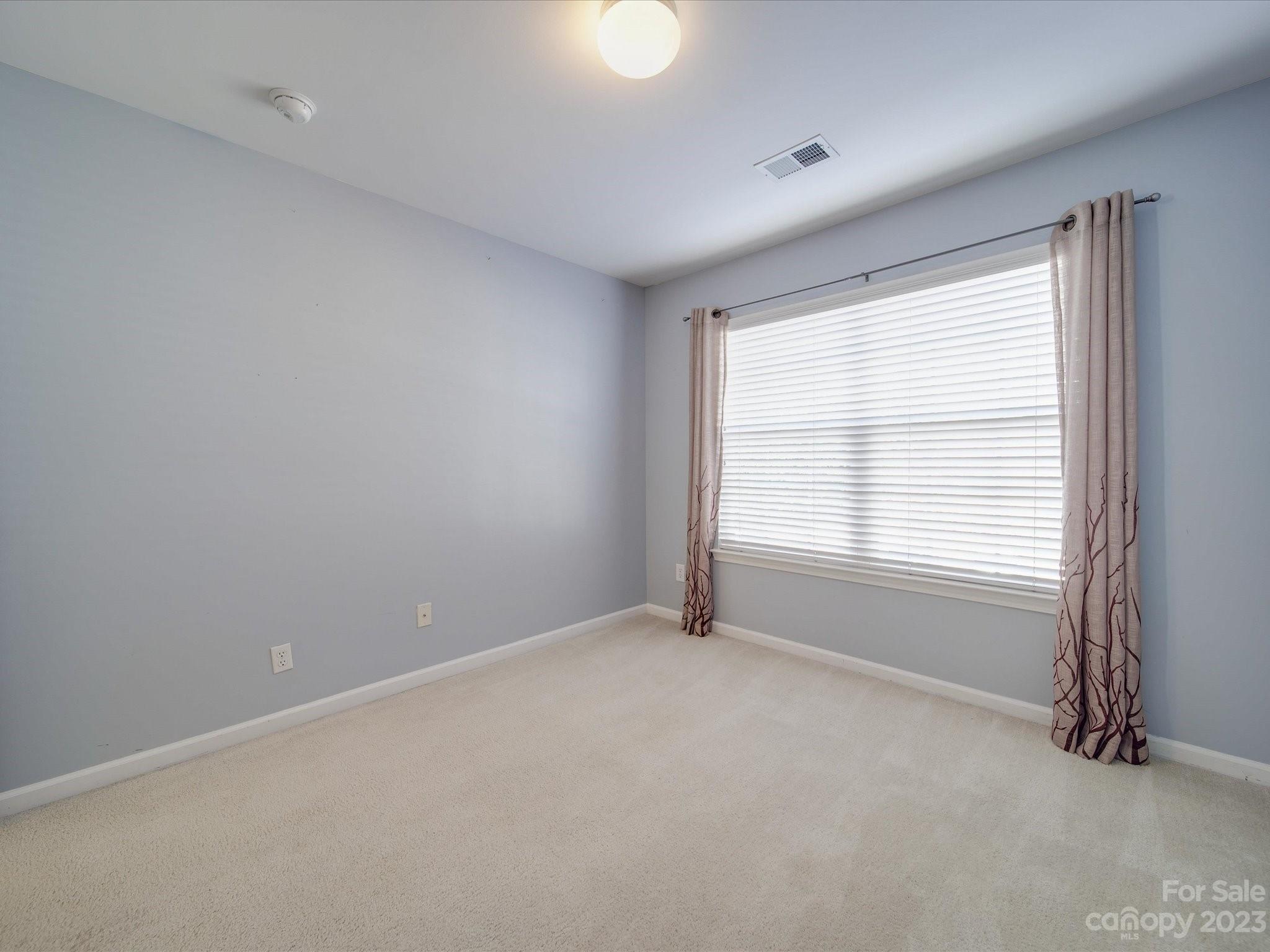 11755 Huxley Road Charlotte, NC 28277 - Photo 25 of 37 a view of an empty room with a window