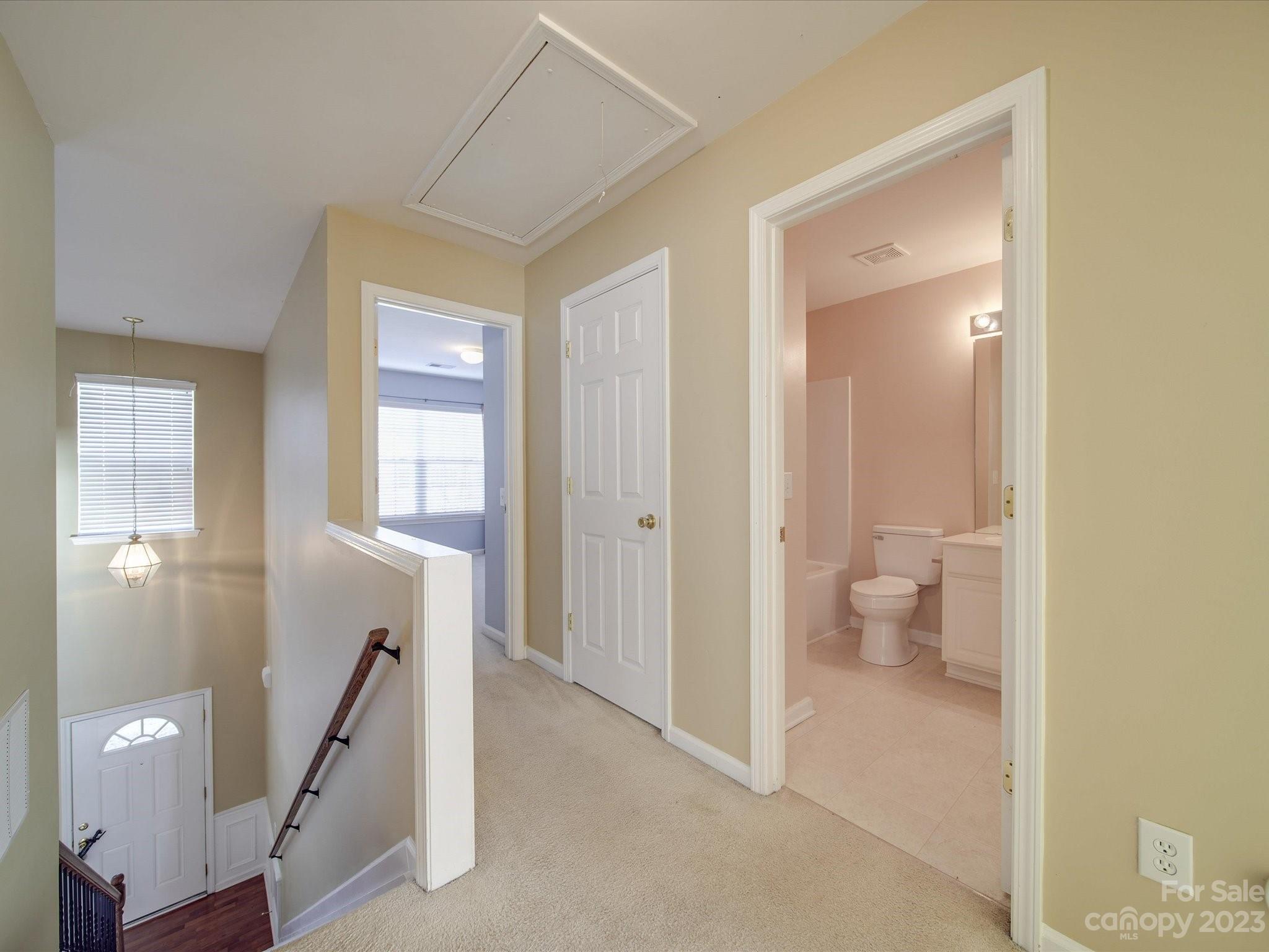 11755 Huxley Road Charlotte, NC 28277 - Photo 30 of 37 a bathroom with a granite countertop sink a toilet and a mirror