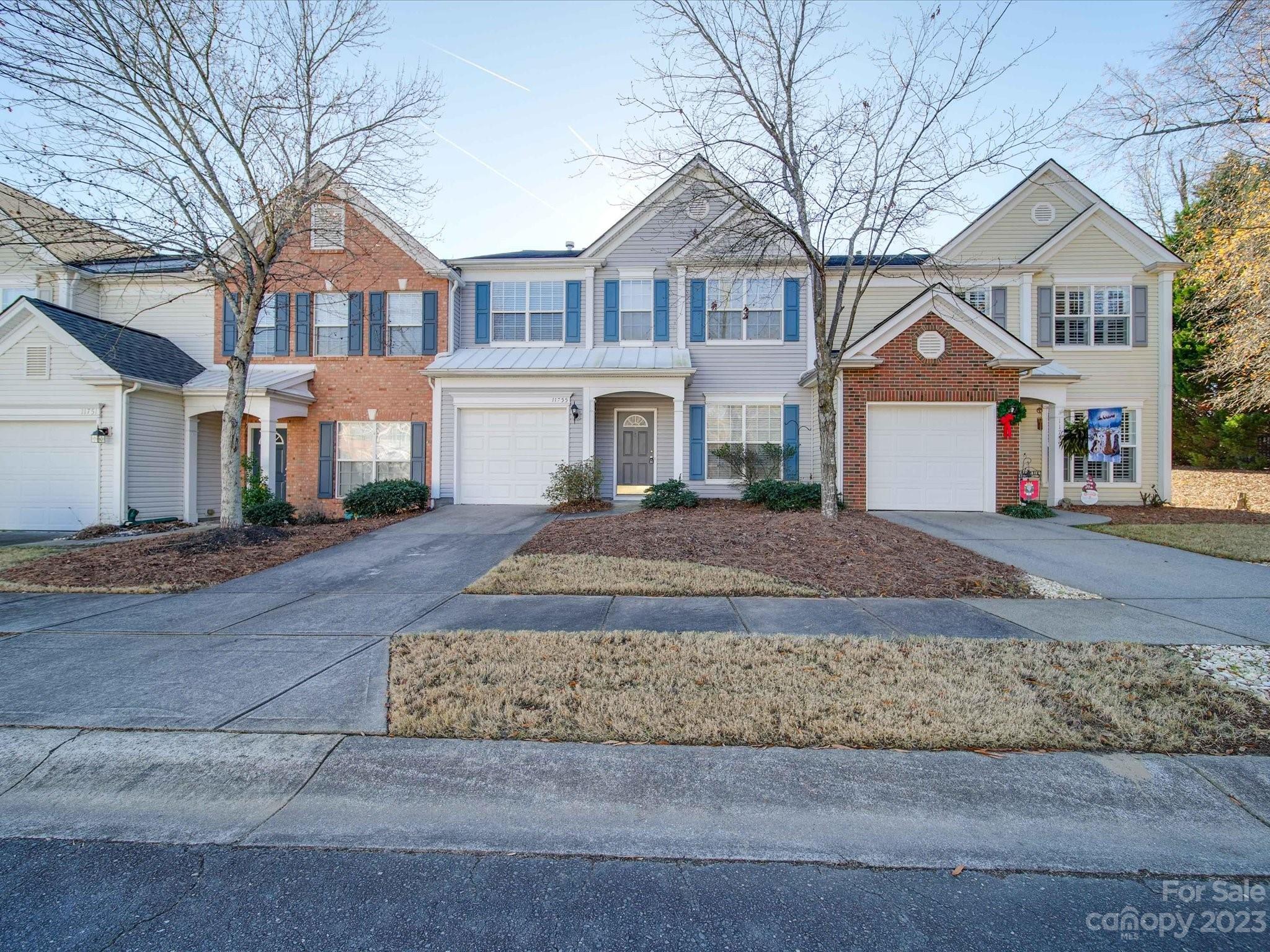 11755 Huxley Road Charlotte, NC 28277 - Photo 3 of 37 front view of a house next to a yard
