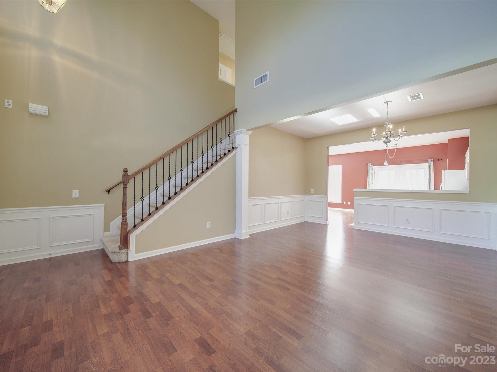 11755 Huxley Road Charlotte, NC 28277 - Photo 5 of 37 a view of an entryway with wooden floor