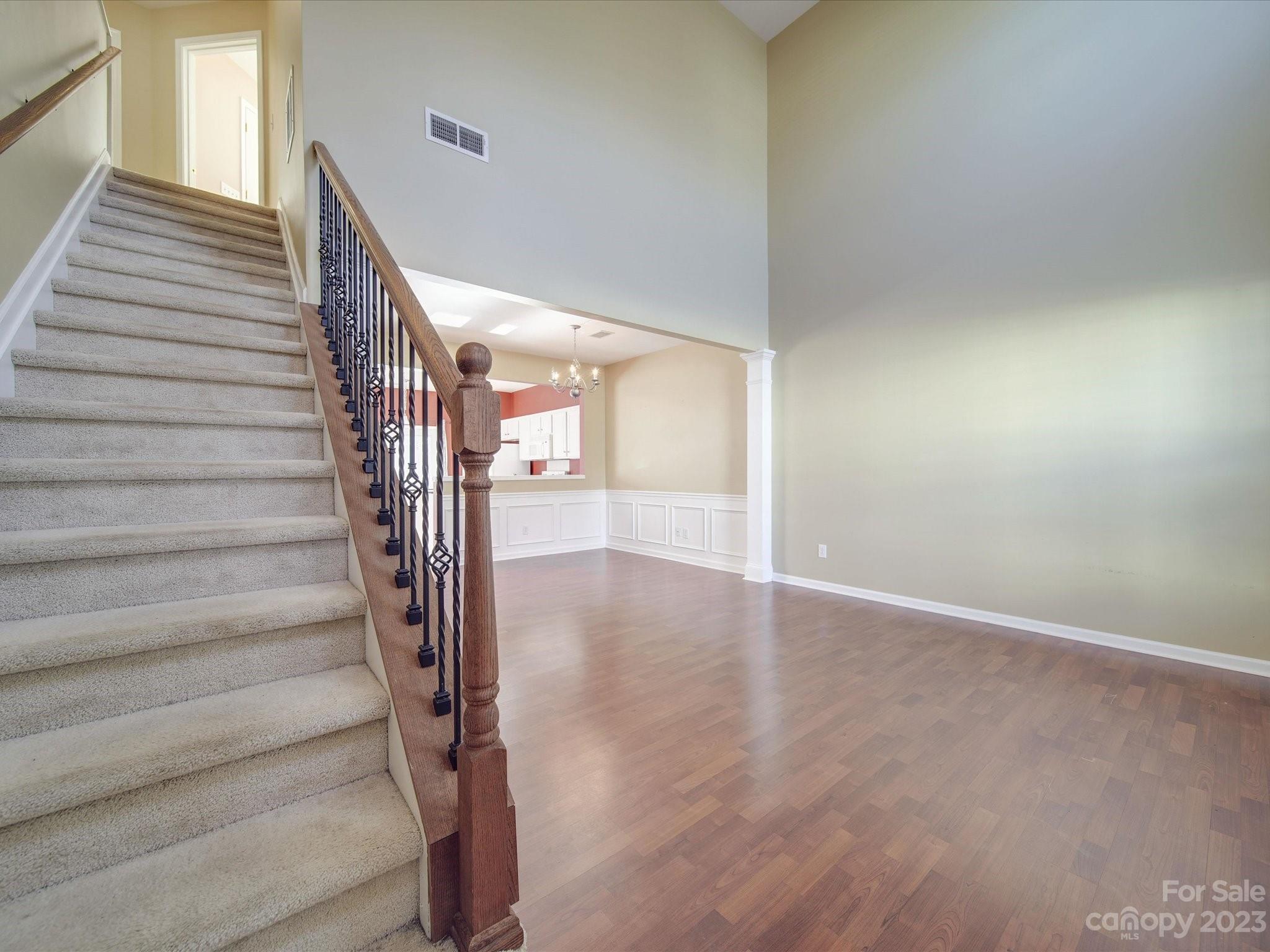 11755 Huxley Road Charlotte, NC 28277 - Photo 6 of 37 a view of an entryway with wooden floor