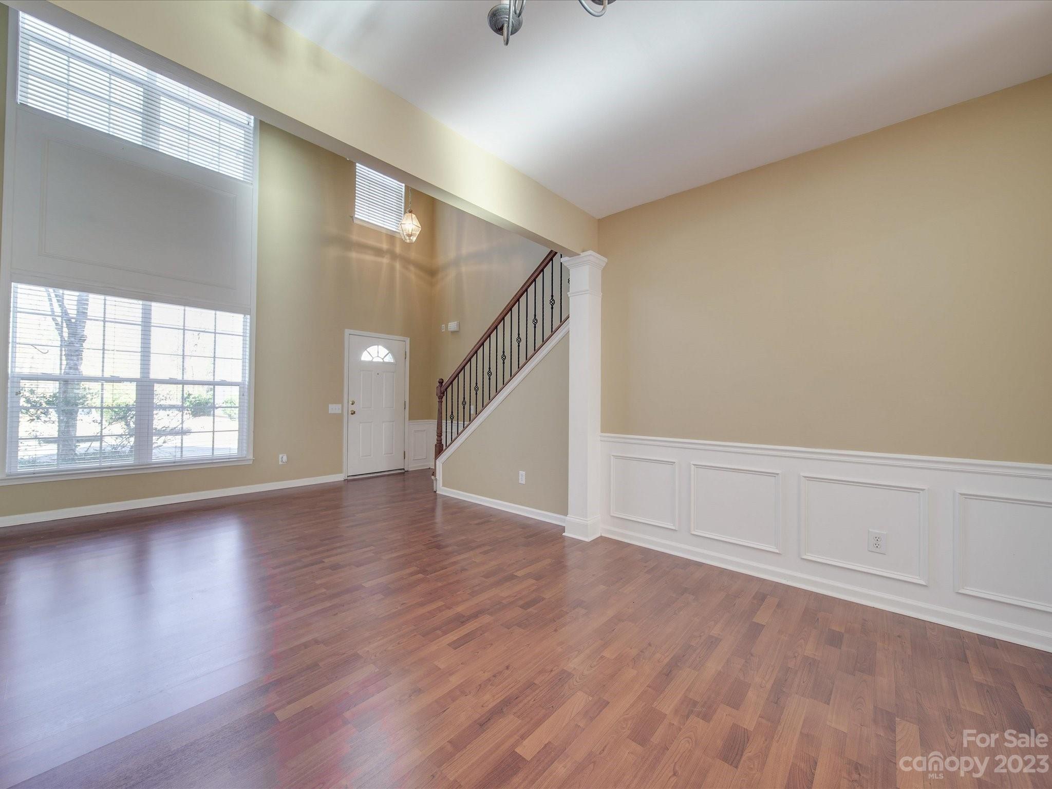 11755 Huxley Road Charlotte, NC 28277 - Photo 7 of 37 wooden floor in an empty room with a window