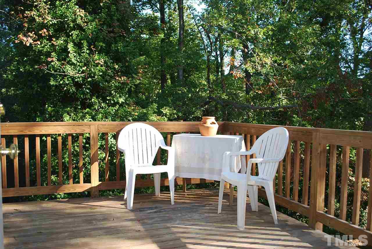 2274 The Circle Raleigh, NC 27608 - Photo 16 of 25 a view of a chairs and table on the deck