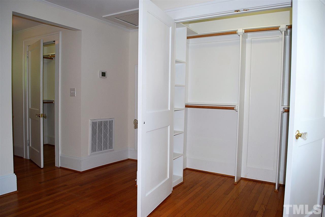 2274 The Circle Raleigh, NC 27608 - Photo 19 of 25 an empty room with wooden floor and closet