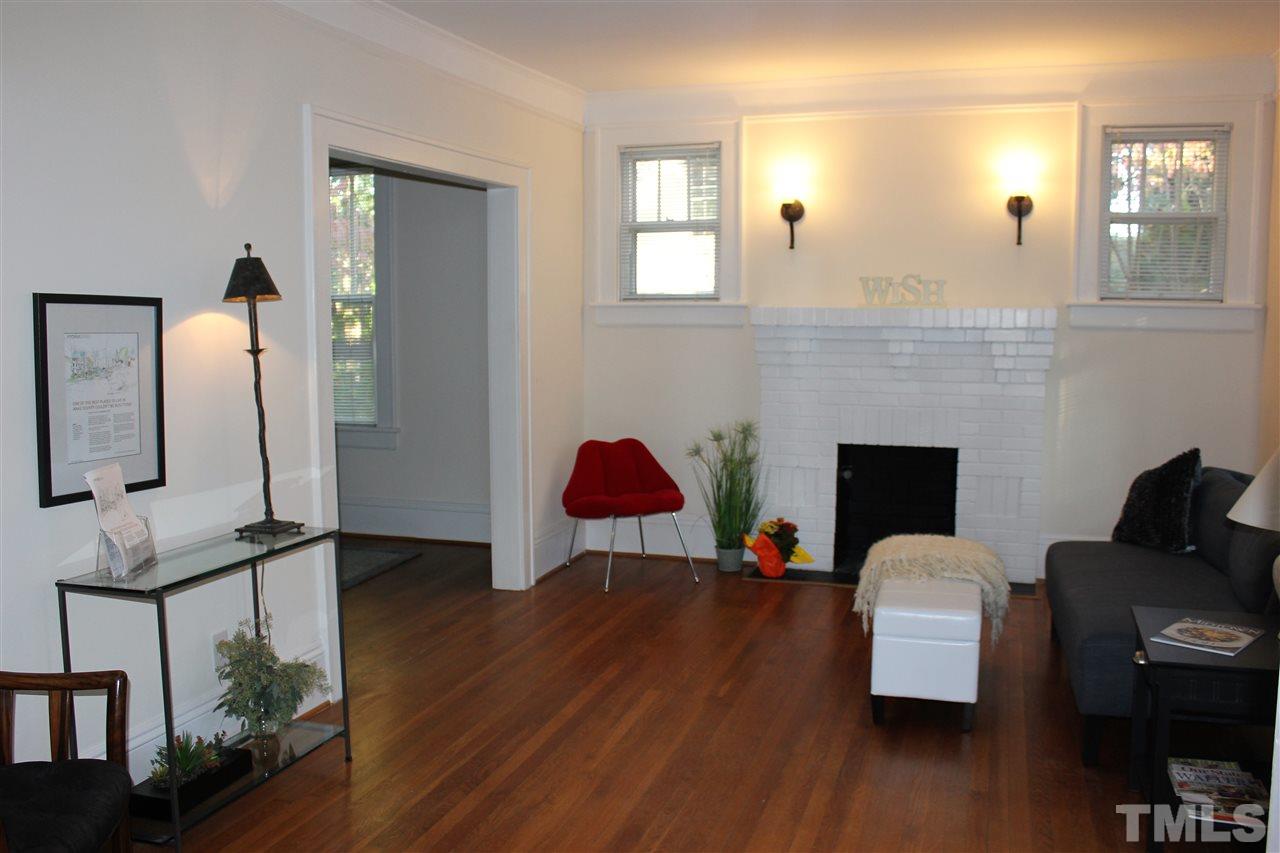 2274 The Circle Raleigh, NC 27608 - Photo 2 of 25 a view of a livingroom with furniture and a fireplace