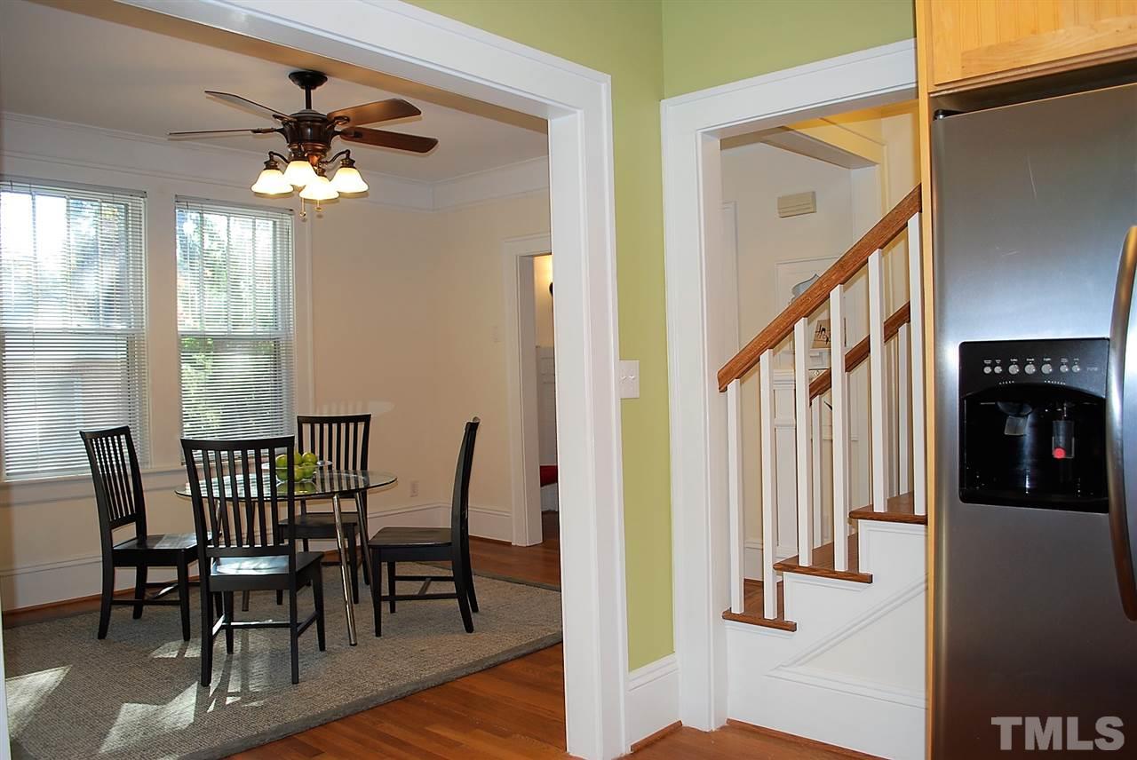 2274 The Circle Raleigh, NC 27608 - Photo 6 of 25 a view of a dining room with furniture and a chandelier
