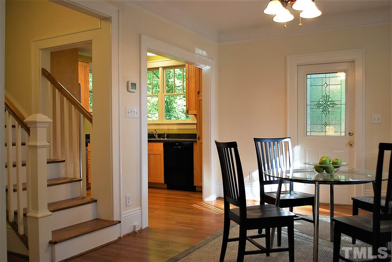 2274 The Circle Raleigh, NC 27608 - Photo 8 of 25 a view of a dining room with furniture window and wooden floor